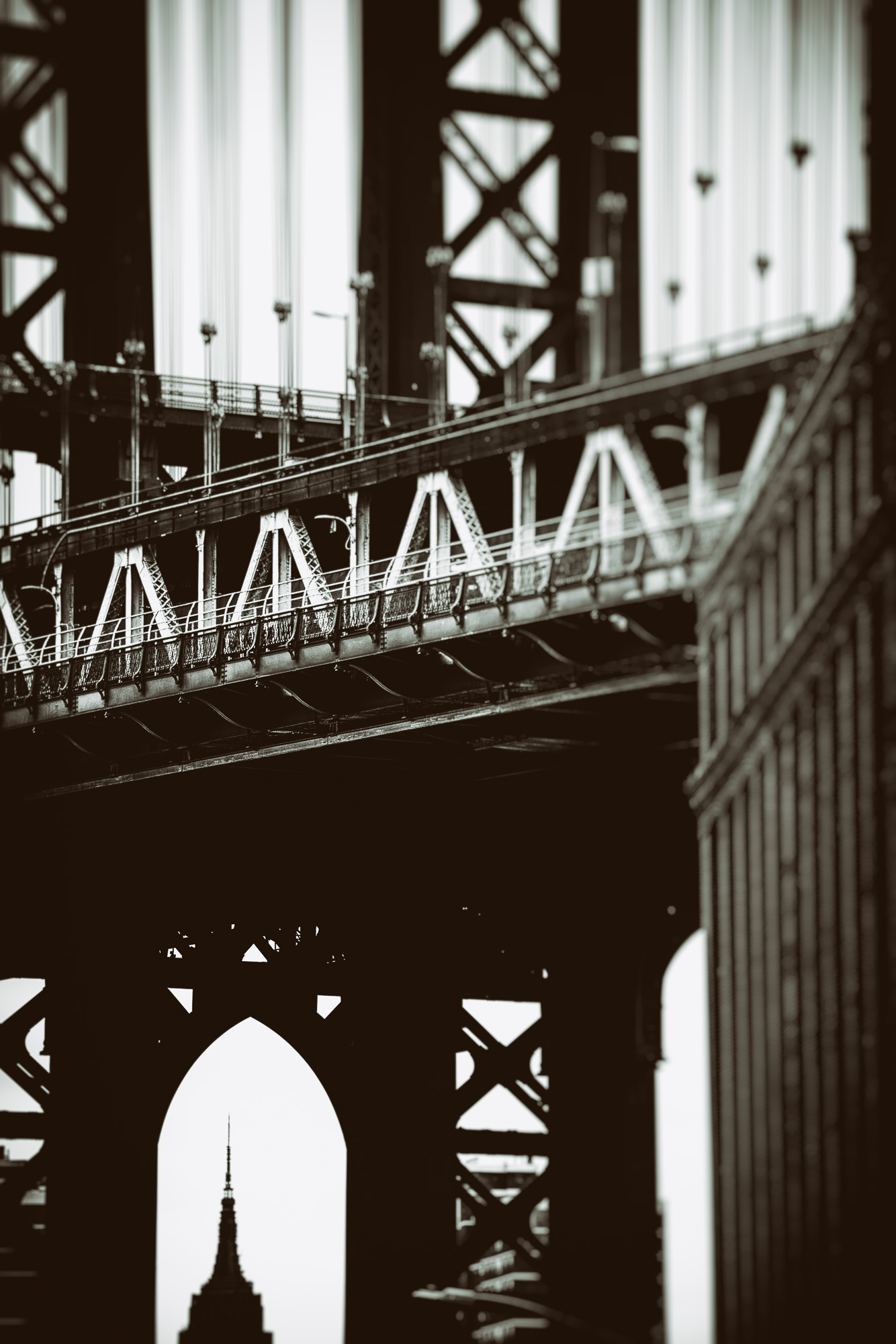 Empire State framed by Manhattan Bridge