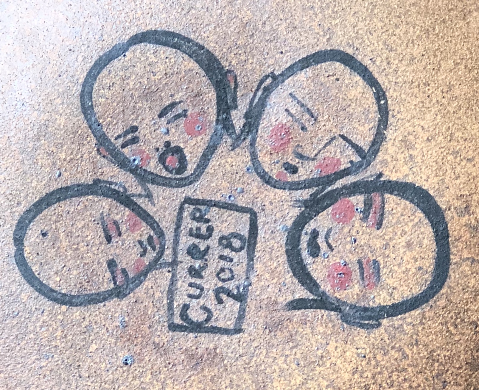 Underside of pot with signature & hand-painted faces