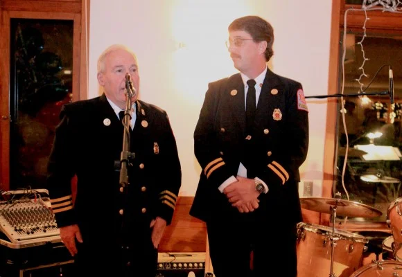 Butch Sutherland congratulates Dave Green.