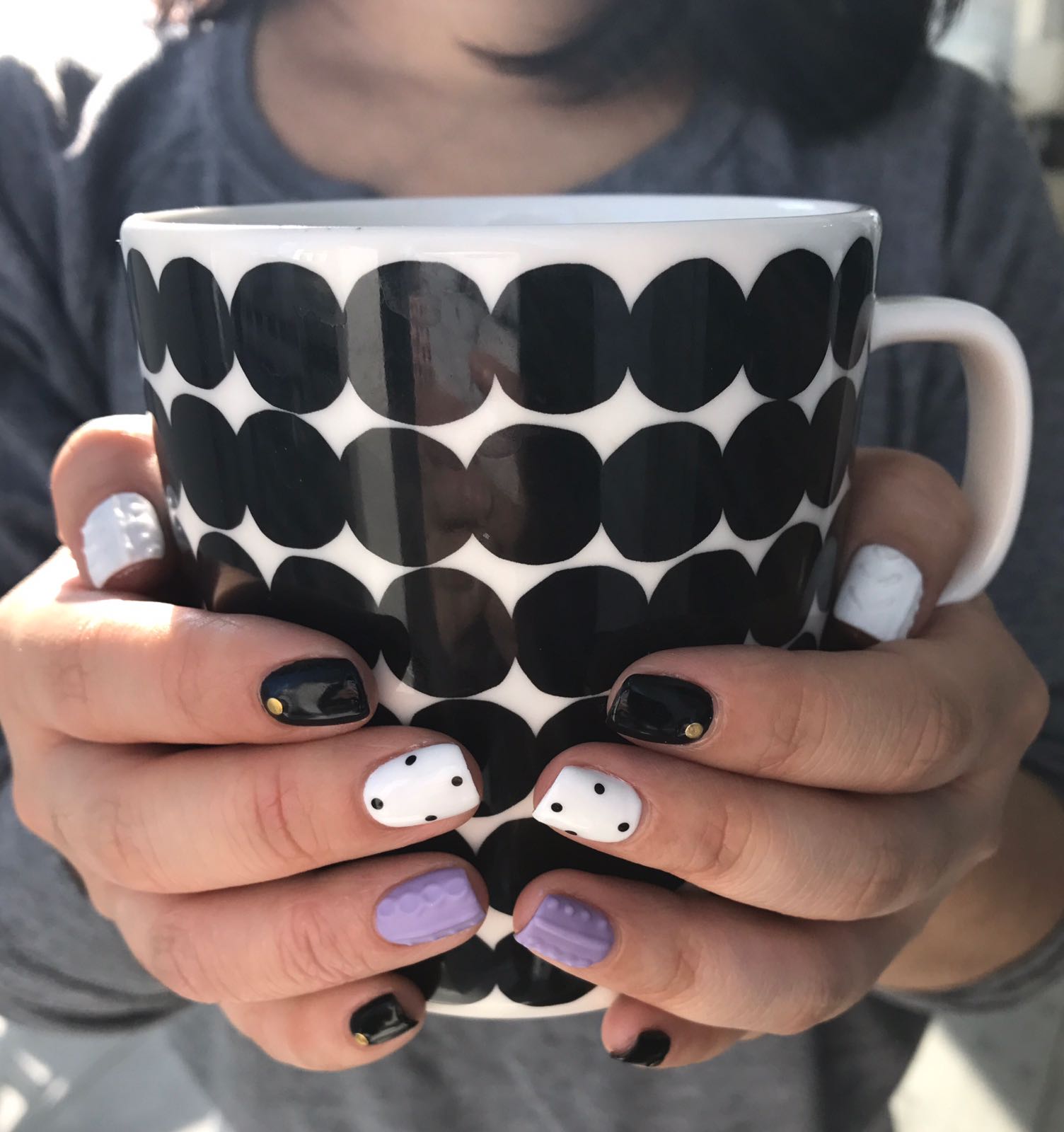 fixing her nail polish