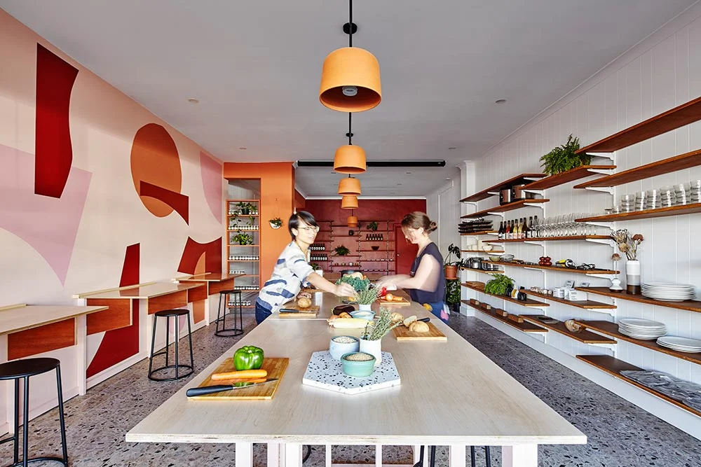 Yvonne Meng and Amber Laing of Circle Studio Architects in their completed interior fitout for Melbourne social enterprise Free to Feed.