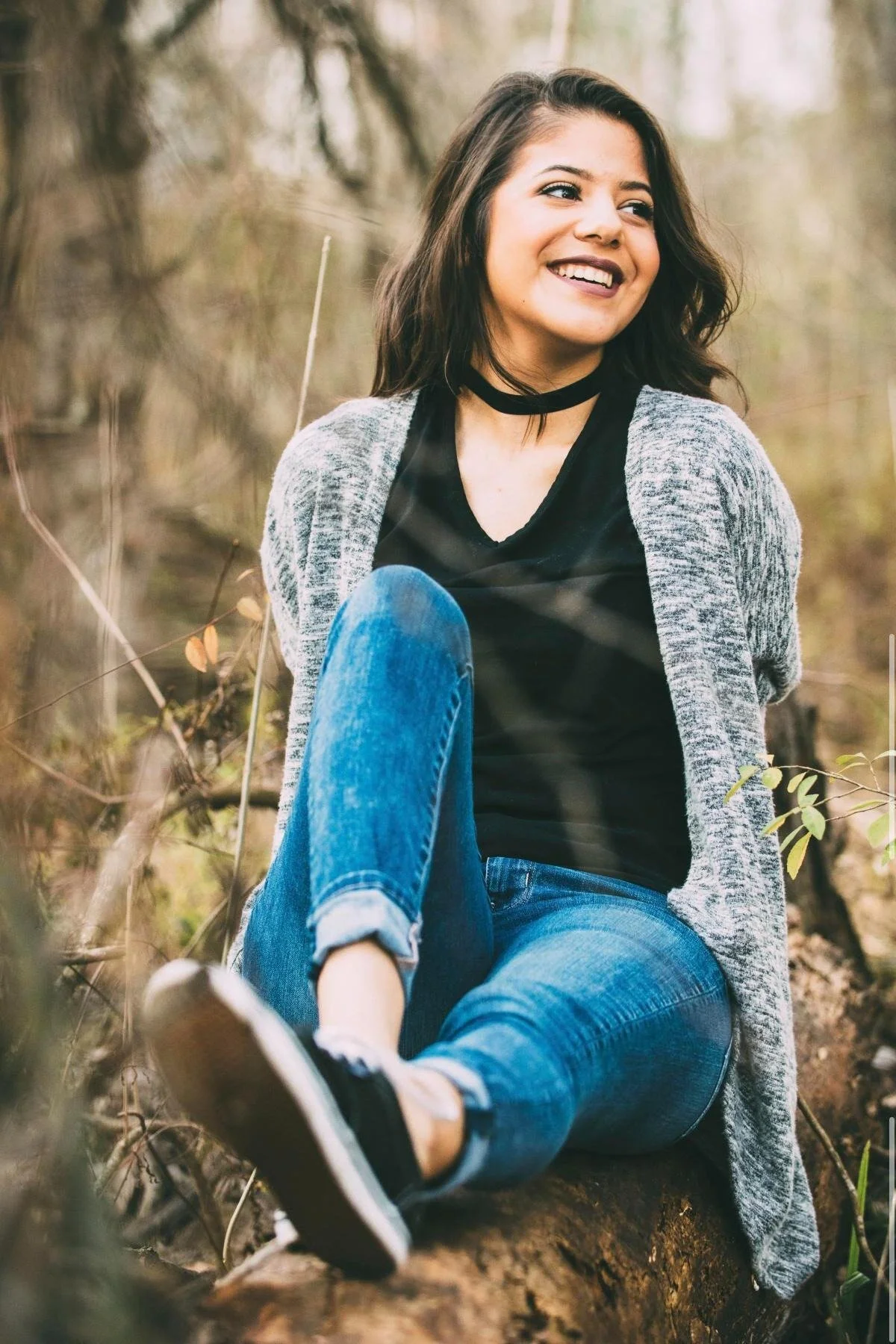 Portrait of a woman laughing while sitting outdoors, Orkams collab series