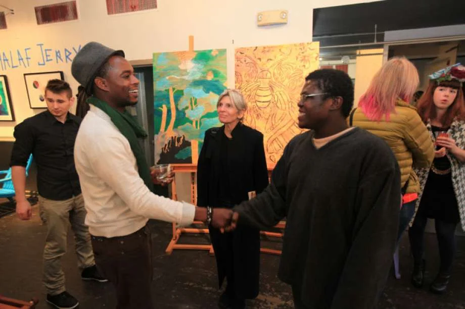 Hour photo / Chris Palermo. Artist Khalaf Jerry greets Pierre Antoine Jr. at the “Holiday Social Fiber Fabric Arts & Makers” pop up art show presented by Pop City Saturday in Norwalk.