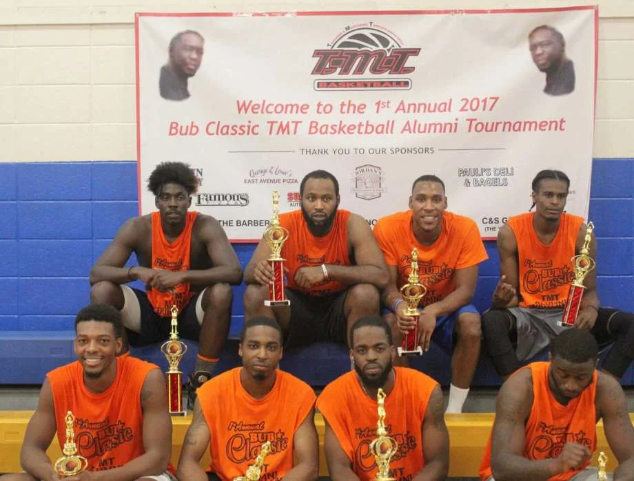 This team of TMT Basketball alumni won last weekend’s tournament. From left: front row, Evan Kelly, John Boykin, Brian Wade and Moriba Keita; back row, Antwan Boyd, Lamar Tate, Takari Smalls and Tyler Shular.