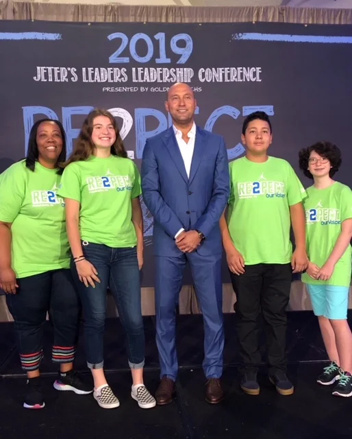 Carver CEO Novelette Peterkin, rising Norwalk 9th graders Chloe Mattus, Sanda Andronic and Alfredo Yepez, with Derek Jeter standing in the middle.