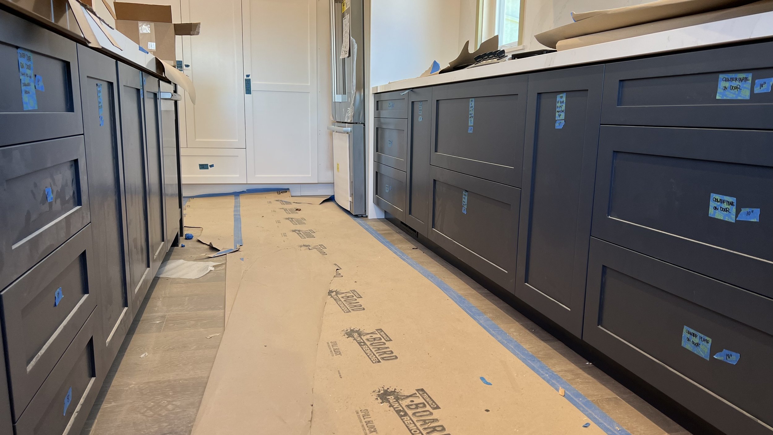  Cabinet hardware has been marked &amp; ready for install. 