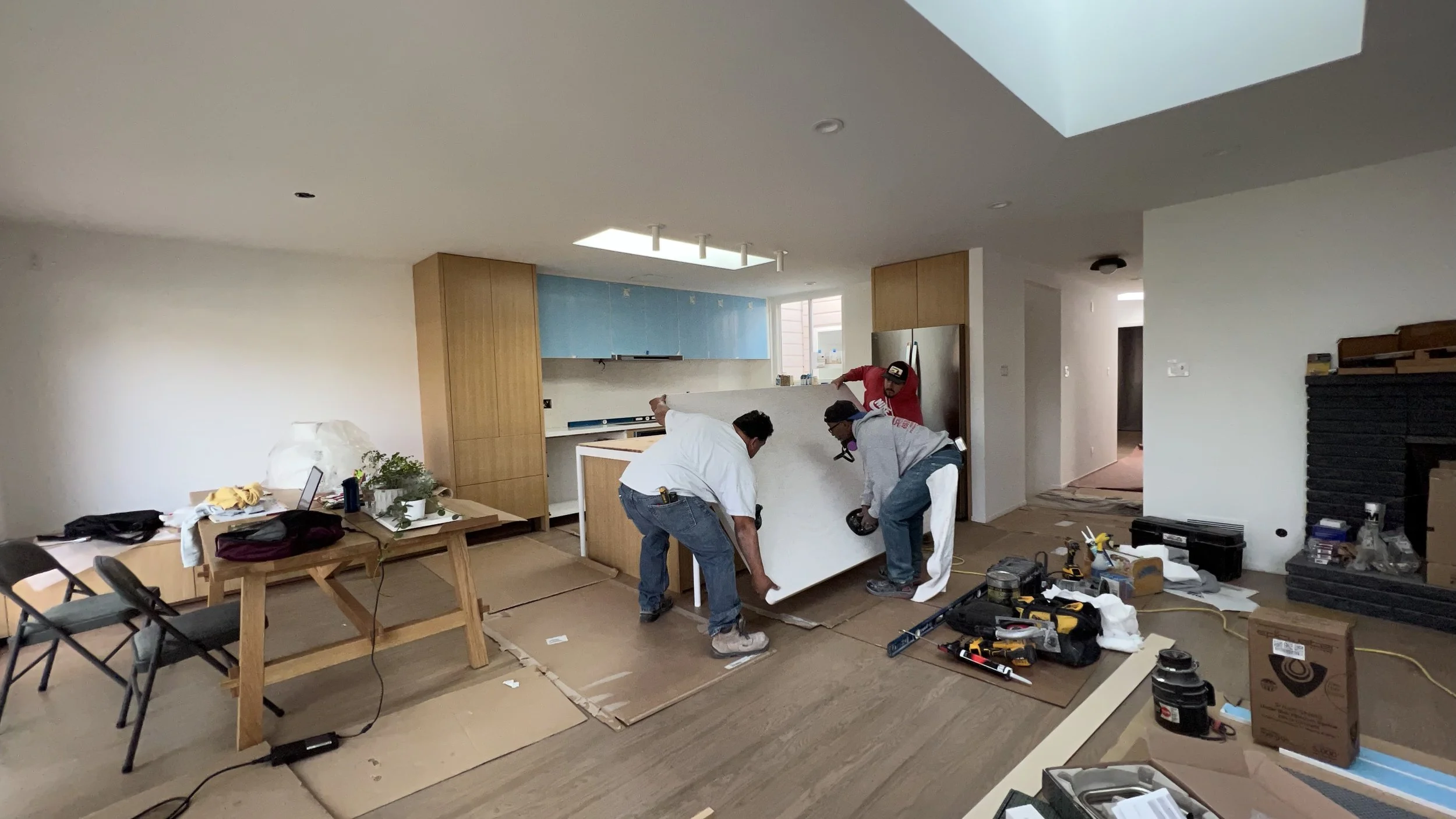  We can breathe a sigh of relief after our 56” x 80” single piece island counter was able to make the turn up the stairs to the second floor. 