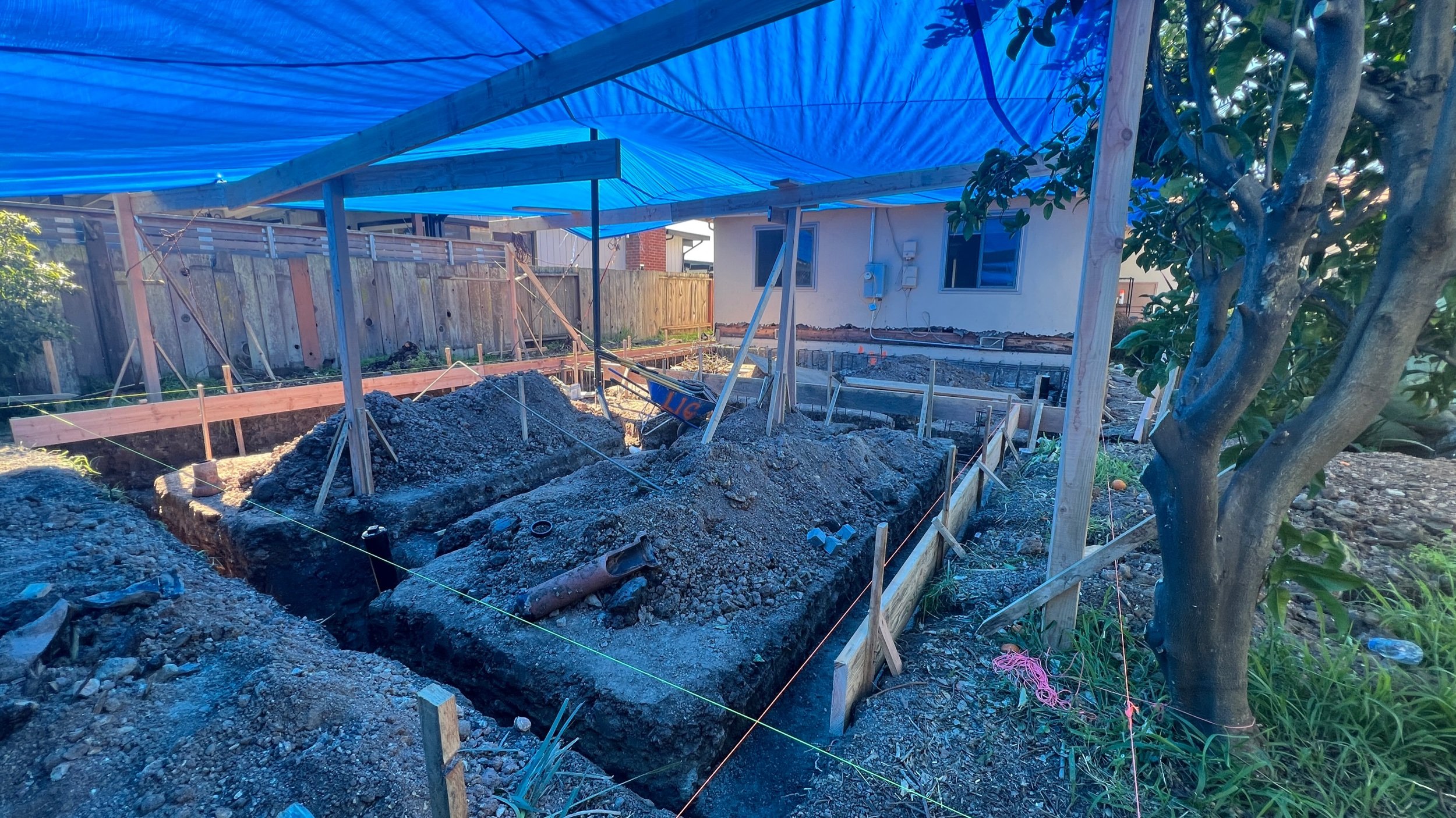 To ensure that there are no future property line disputes our surveyor “staked out” exactly where our addition needs to be located.