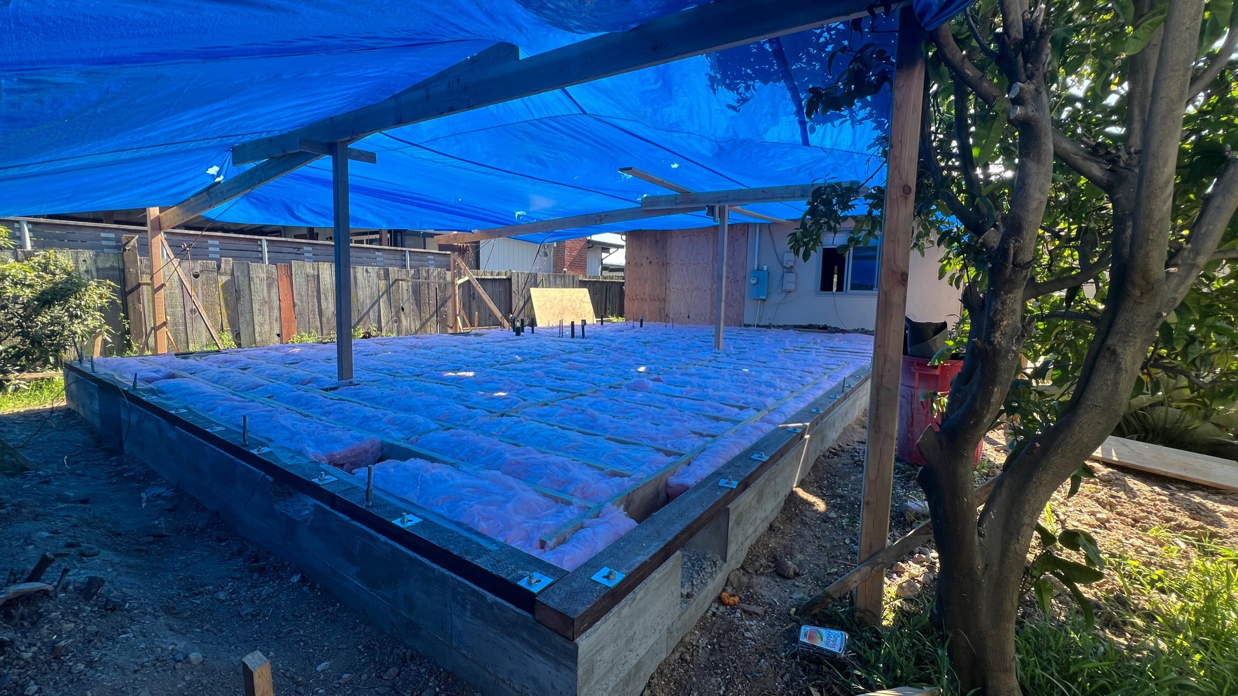 The next domino falls as floor framing & insulation are in!
