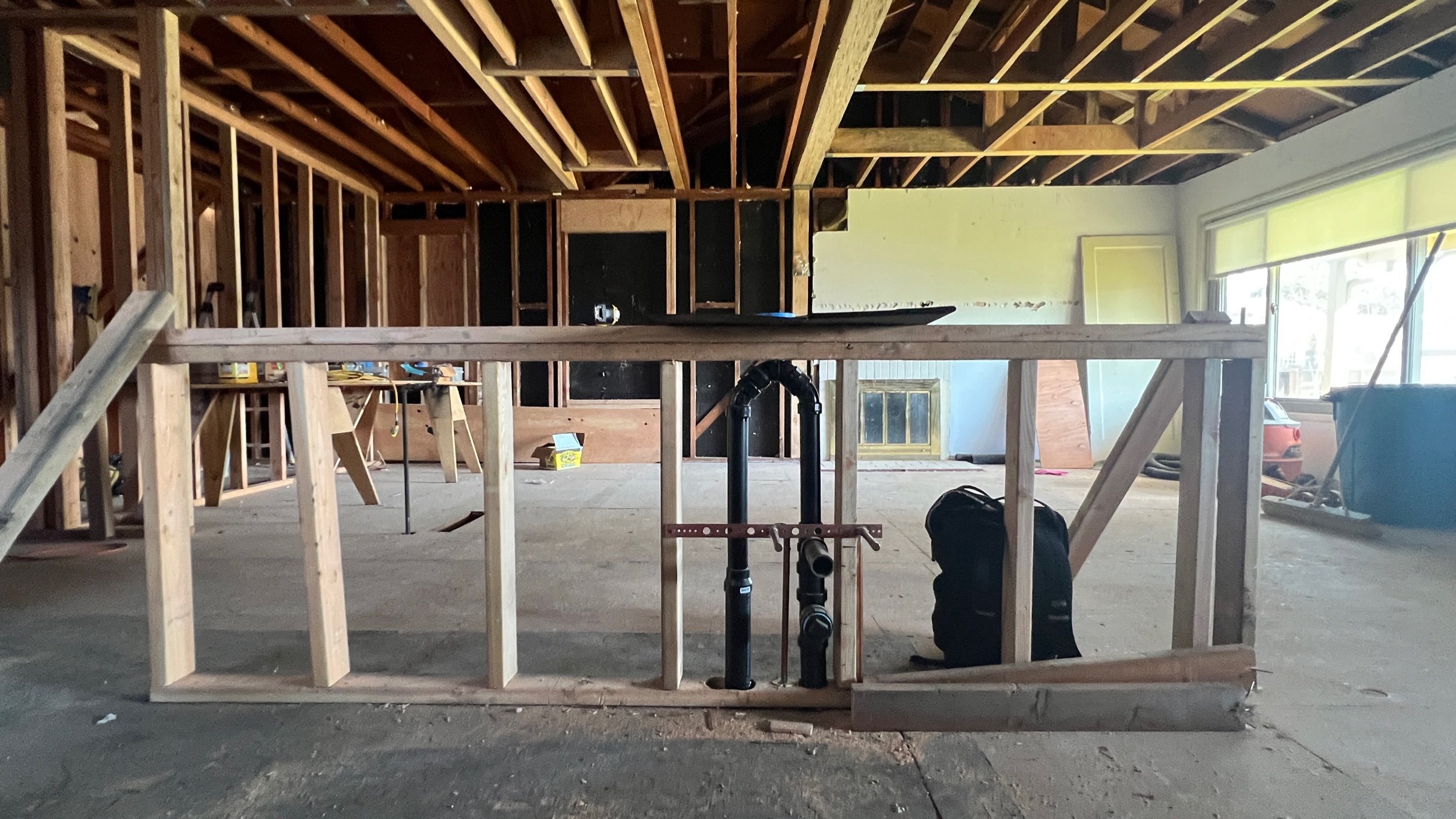 All plumbing in your home must have vents to remove sewer gasses and regulate air pressure in pipes. These vents usually extend within walls & up and out of the roof. Since there are no full height walls at the island, island sinks will typical