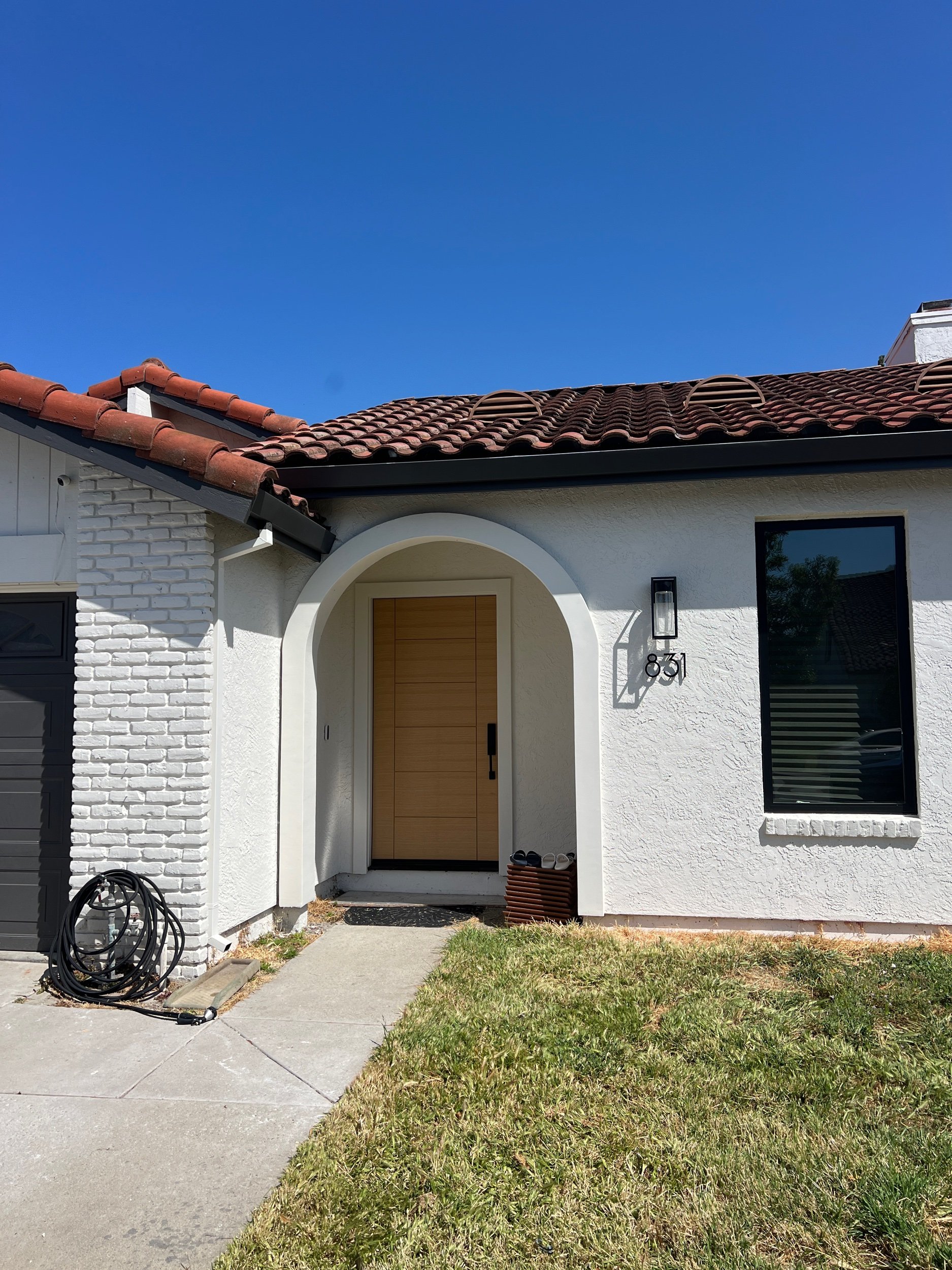 The “welcome home” charm of a new front door & entry accent light.