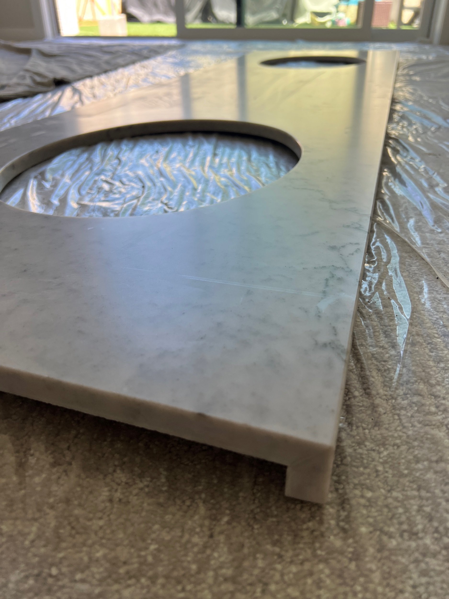 While a counter may appear to be a thick piece of stone, it is actually “built-up” from 3/4” pieces. In order to have a monolithic appearance, our standard is to always miter our counter edges to allow patterns to read continuously.