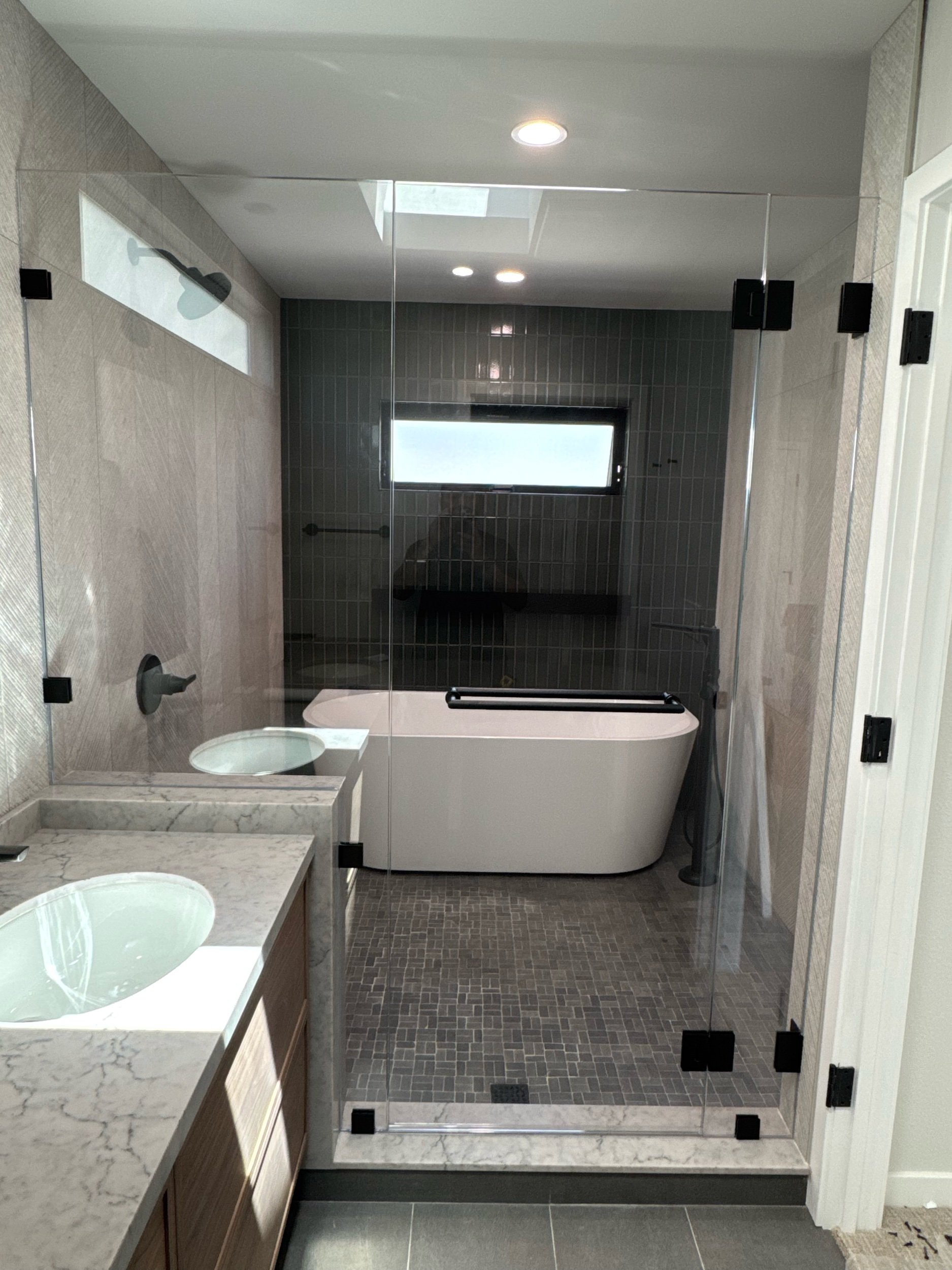 Our glass shower enclosure is complete with low iron glass so that all our shower tile can be enjoyed with a pristine uncolored view - unlike standard glass which has a green tint.