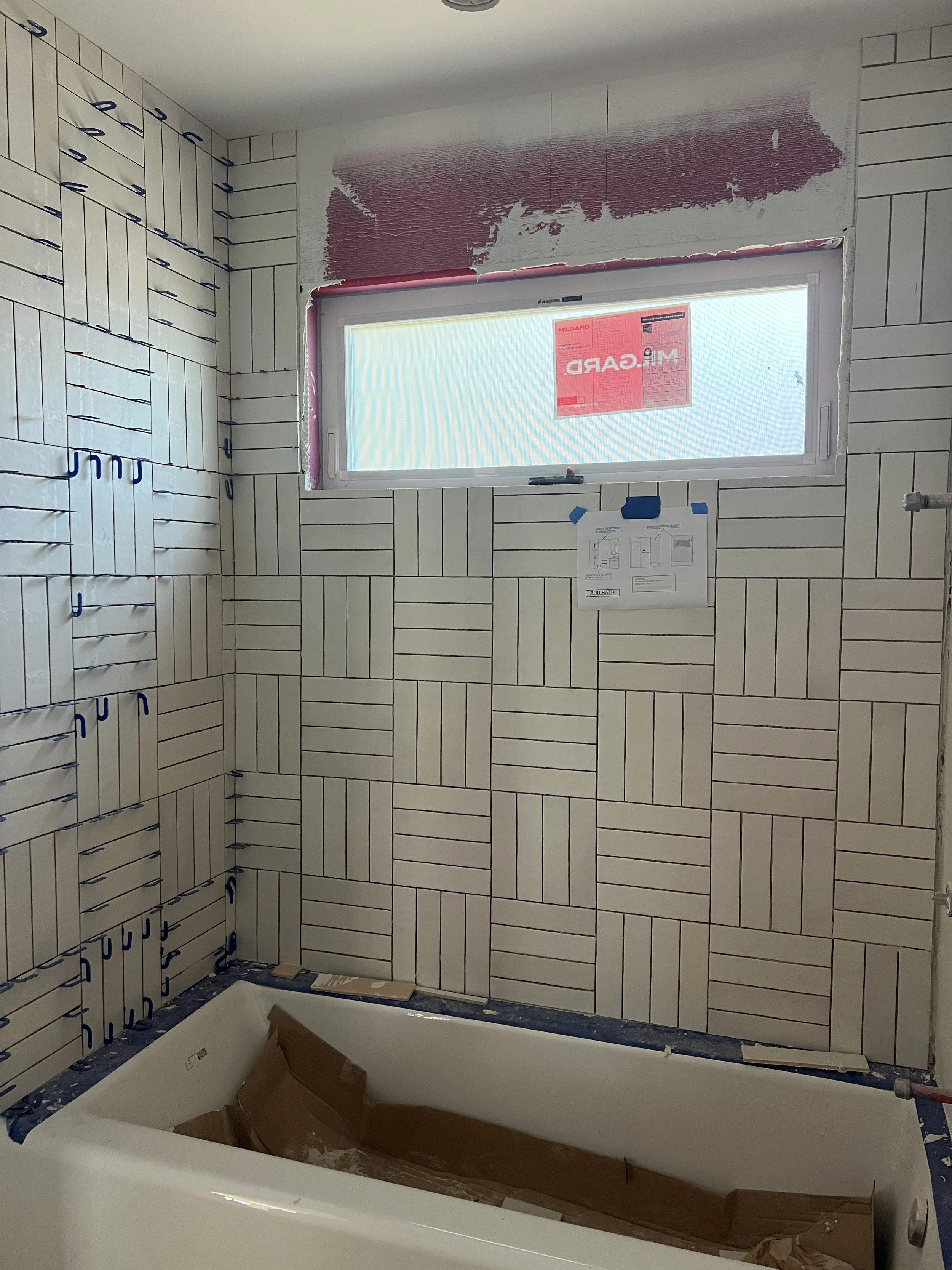  Seeing our ADU Bathroom come to life with our stacked basketweave tile pattern play . 
