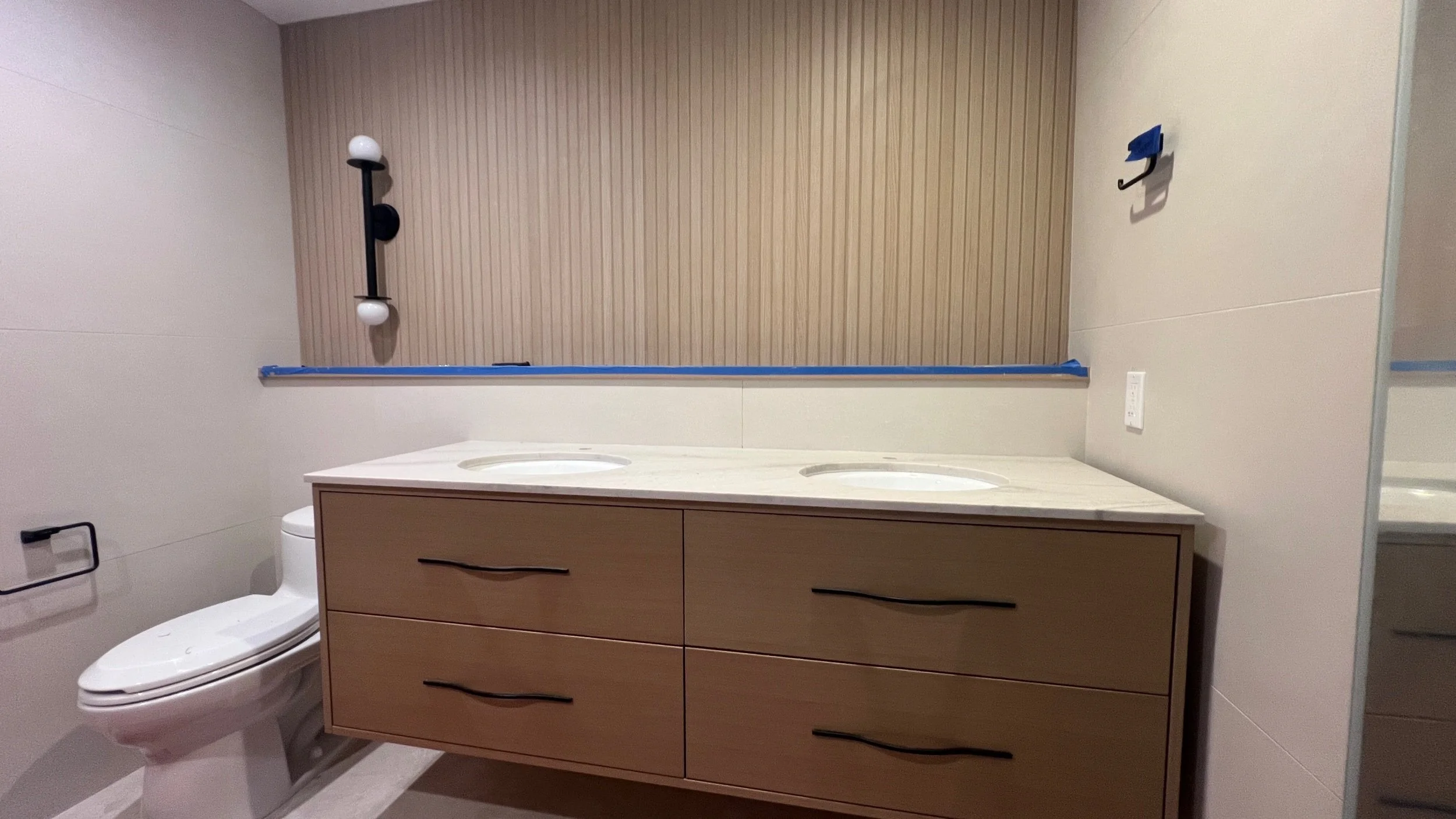 To match our modern vanity, the counter was designed as a thin modern plane. 