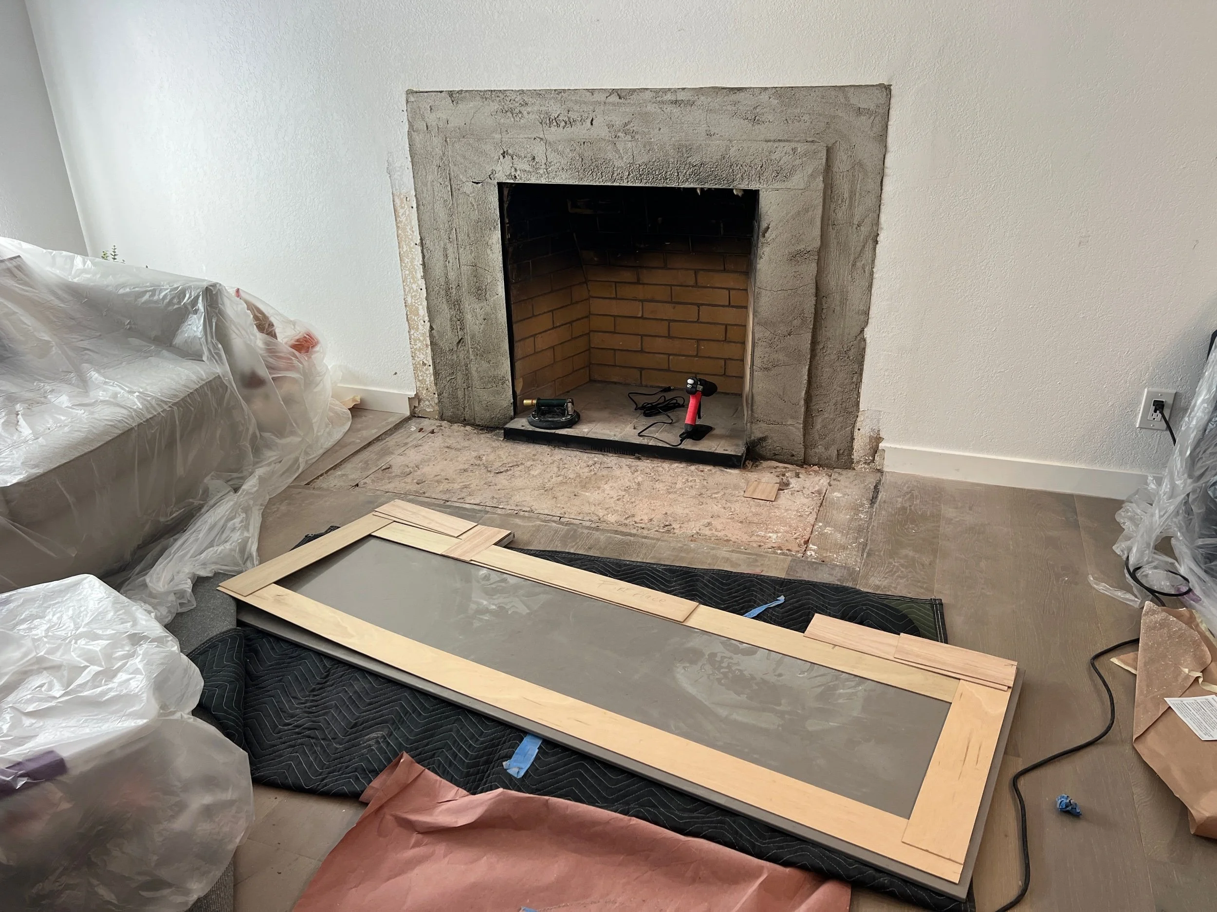Floor & wall are prepped for our new hearth & surround. 