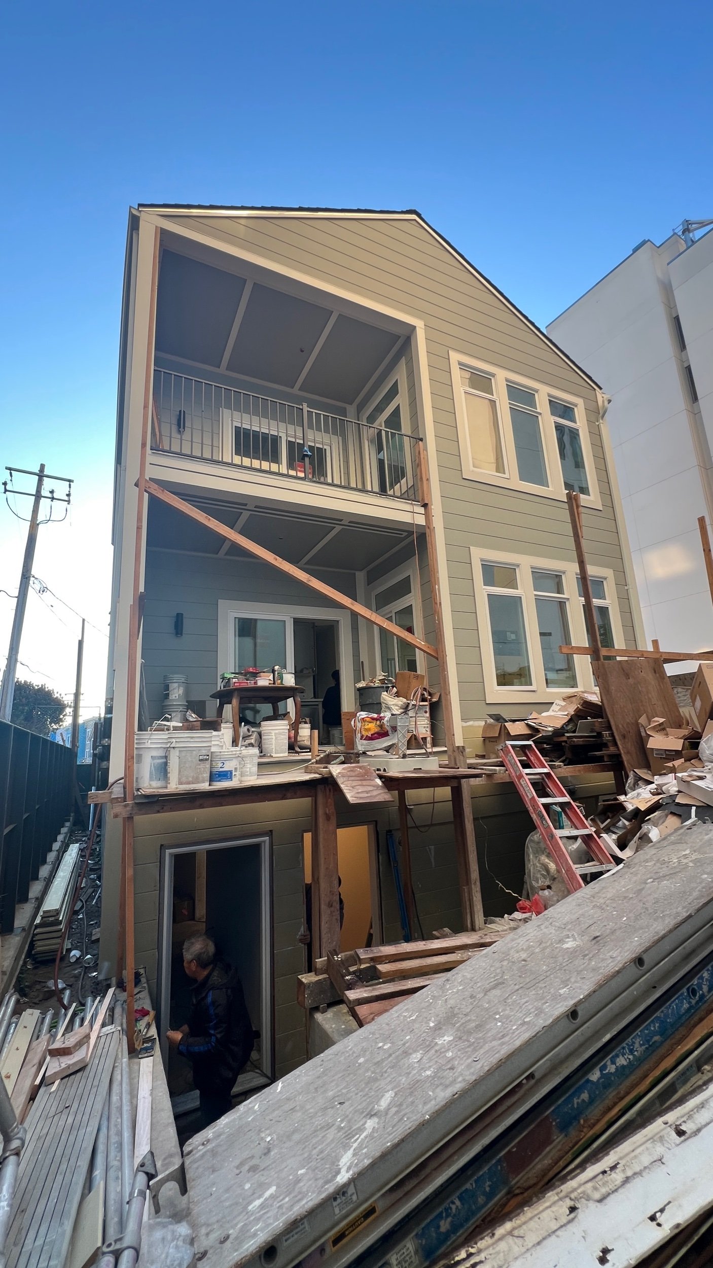  The rear addition is coming into view with new siding, windows, guardrails &amp; lighting all in-progress! 