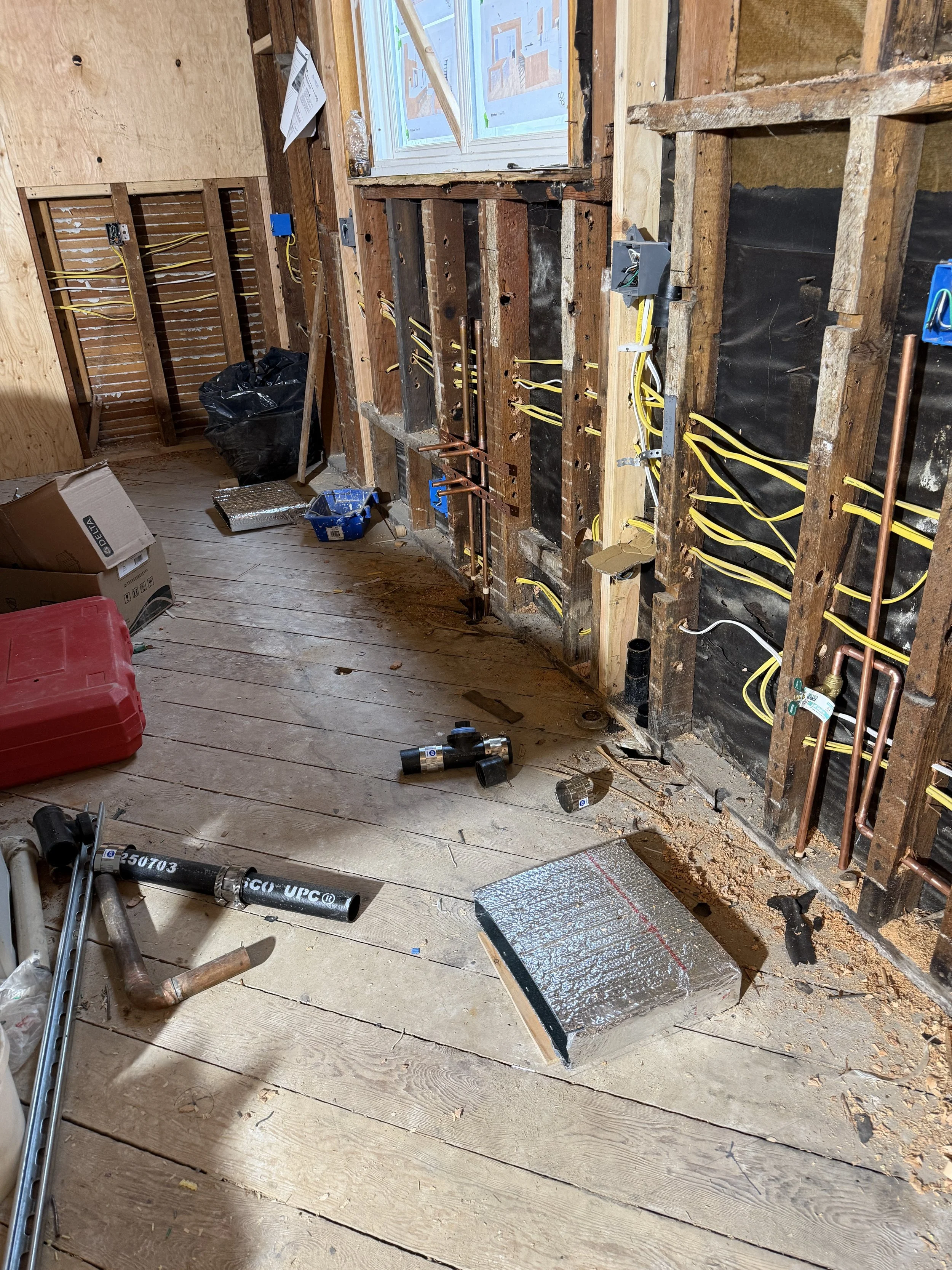With the limited number of walls in our open Great Room, we carefully planned the supply registers to be located beneath the kitchen cabinets. During the rough mechanical phase, the ductwork is carefully positioned to align with these locations.