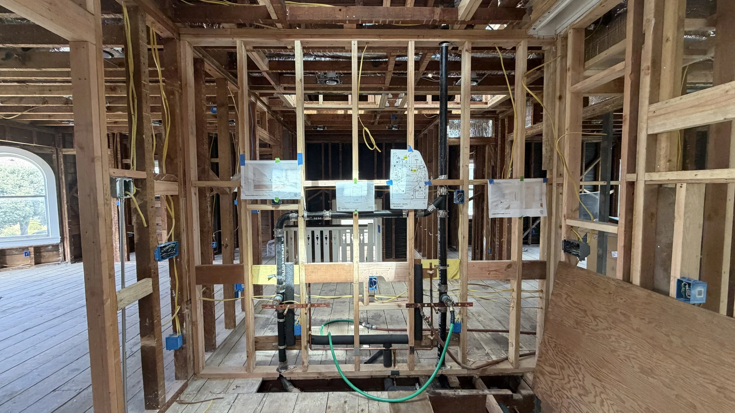 Where careful coordination is required, we are never shy to tape up a subtle reminder... or four for our contractor. 
  
Here we need careful electrical placement for 1) in-vanity dryer outlet, 2) mirror defogger pads, 3) through mirror sconce, and 4