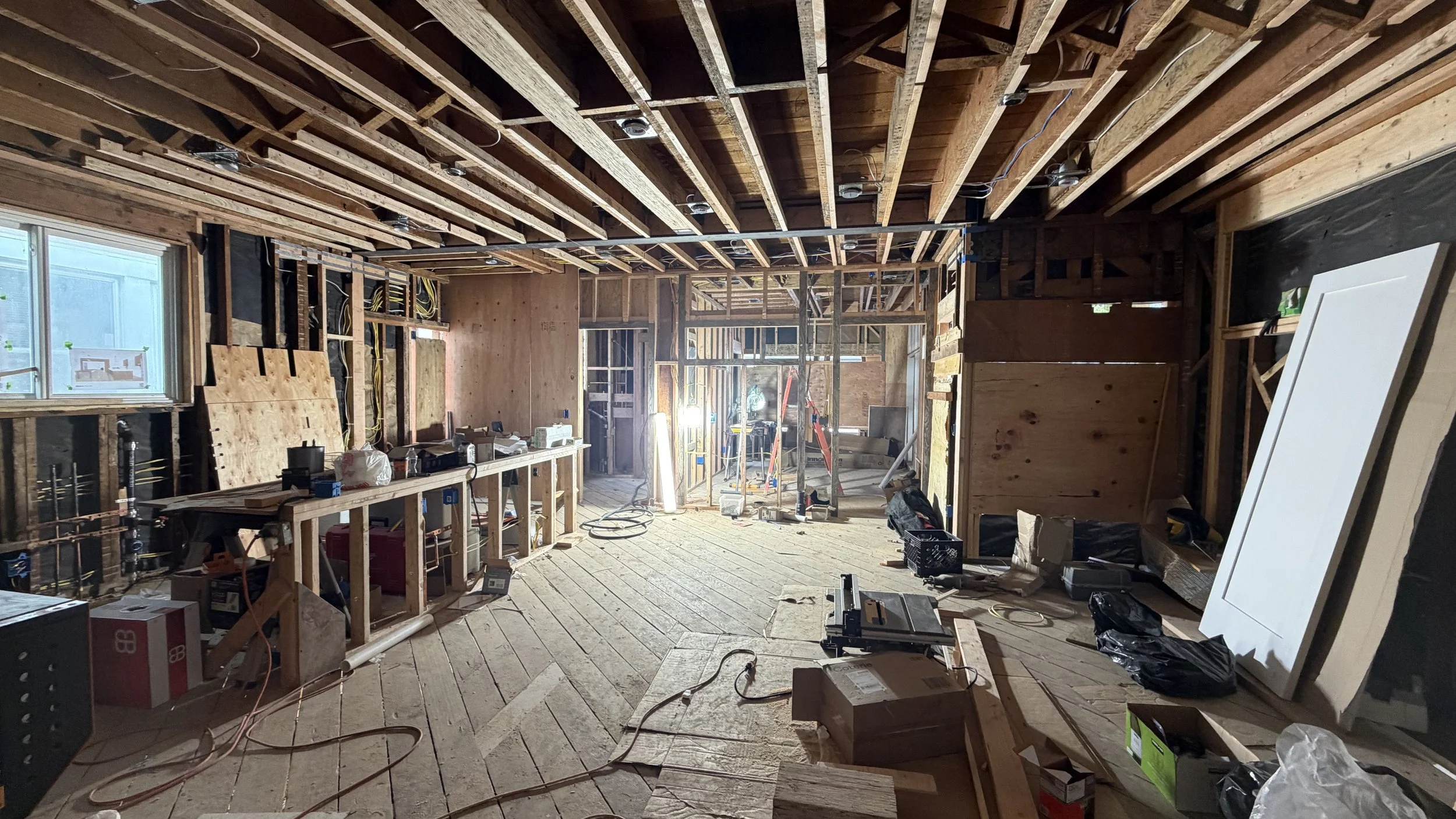 Following rough framing is rough mechanical, rough electrical & rough plumbing which are often performed in parallel. 
  
Rough mechanical includes installation of supply/return air ductwork, kitchen hood ducting, & bathroom exhaust ducts.
  
Rough e