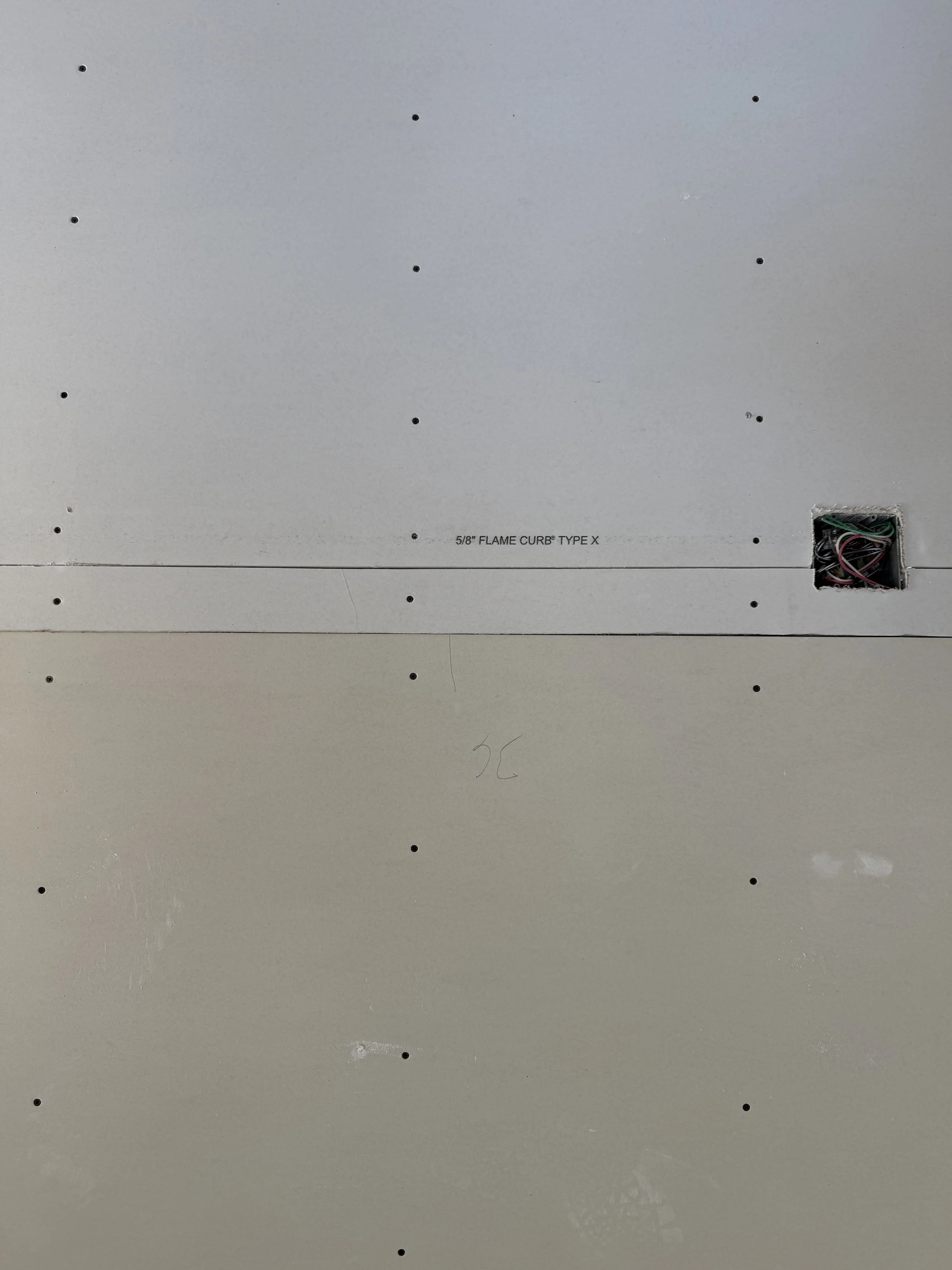 During drywall inspections, Building Inspectors will be checking for the correct number of screws & proper spacing.  Required board thickness, fire-resistance rating, & correct staggering of joints will also be checked for code compliance before fast
