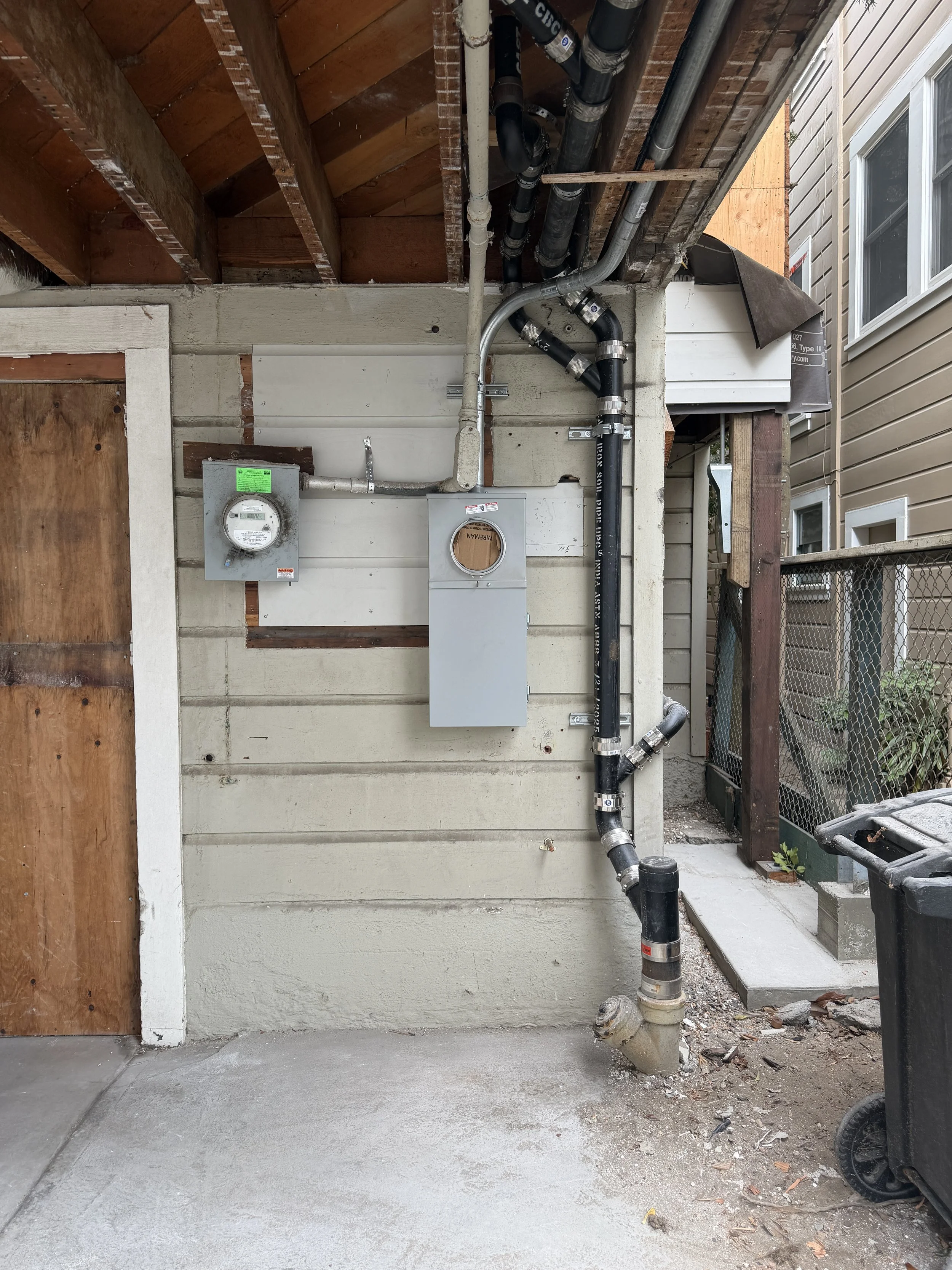 After the building department inspects and approves the new panel on the right, it will be "green tagged" - just as the original panel was on the left.  Only after receiving this approval will PG&E energize the new panel.