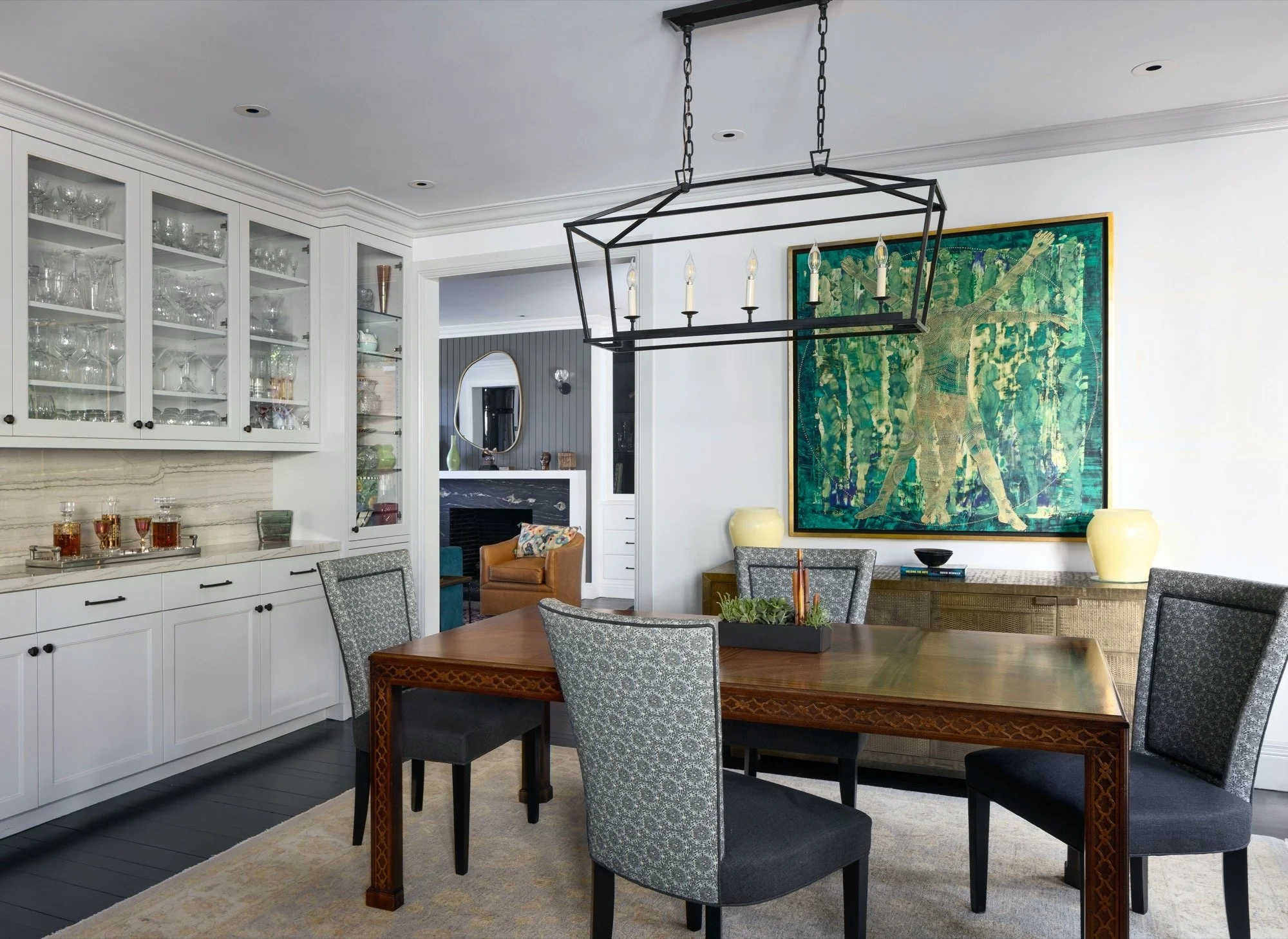  A dining room with a built in sideboard and cabinets. 