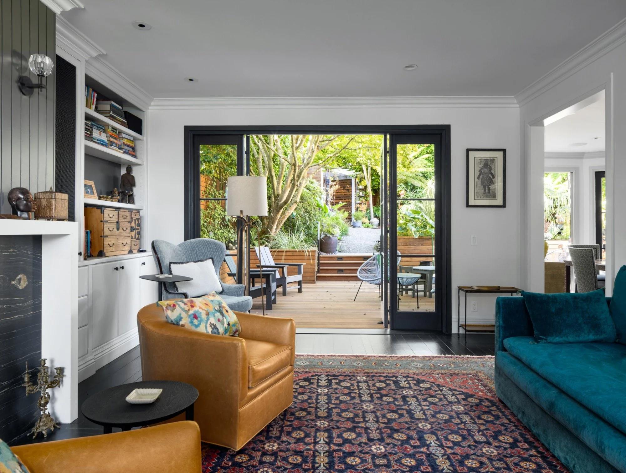  The living room has french doors that open to a back patio. 