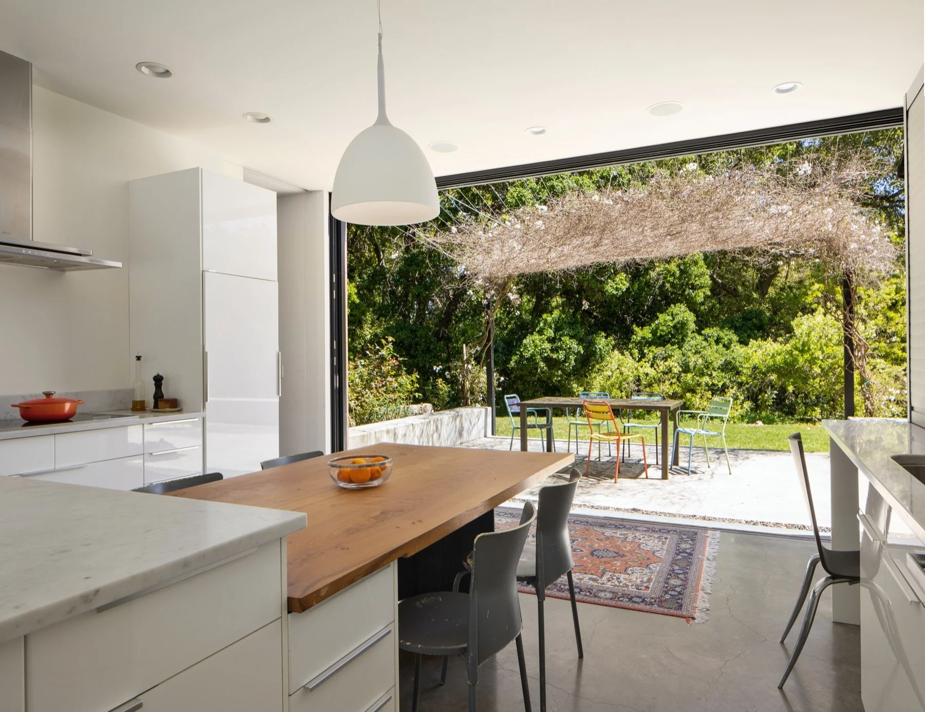  The entire wall of the kitchen opens to the outdoor dining area. 