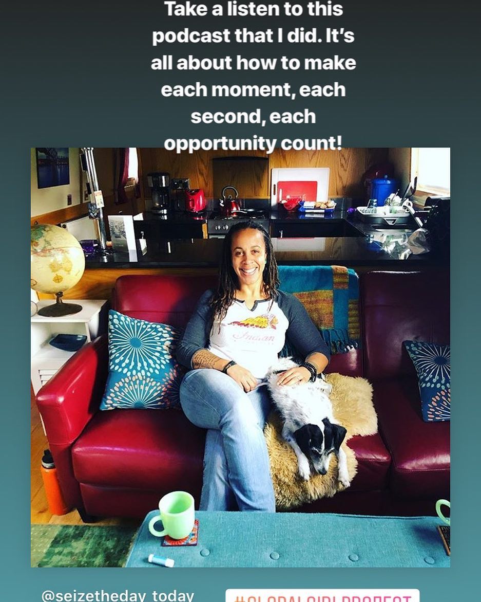 Founding Director, Julia Lynch, in her boat with her dog Lua.