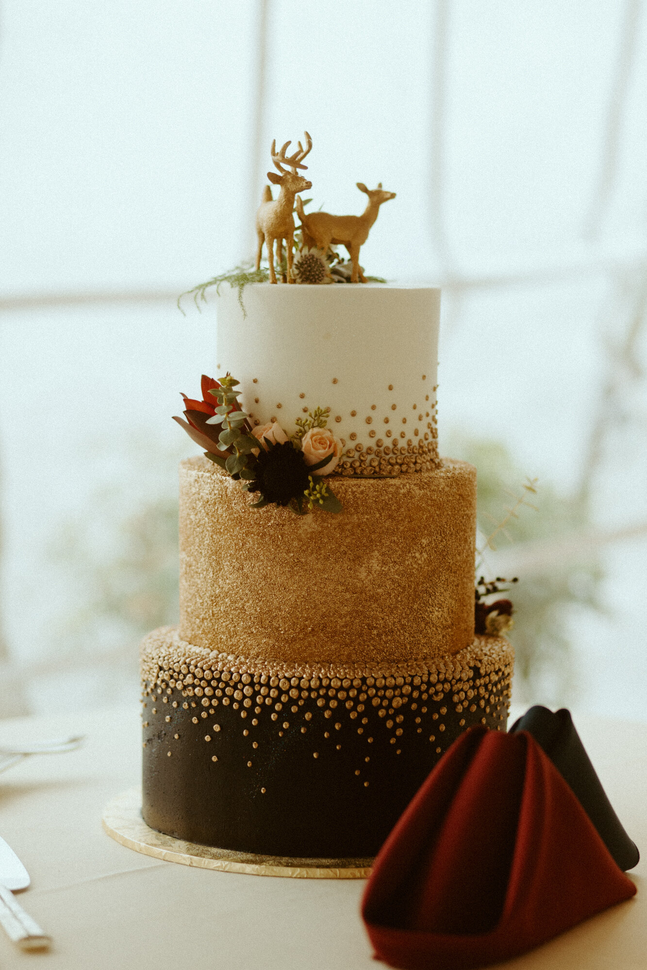 wedding cake with deer topper