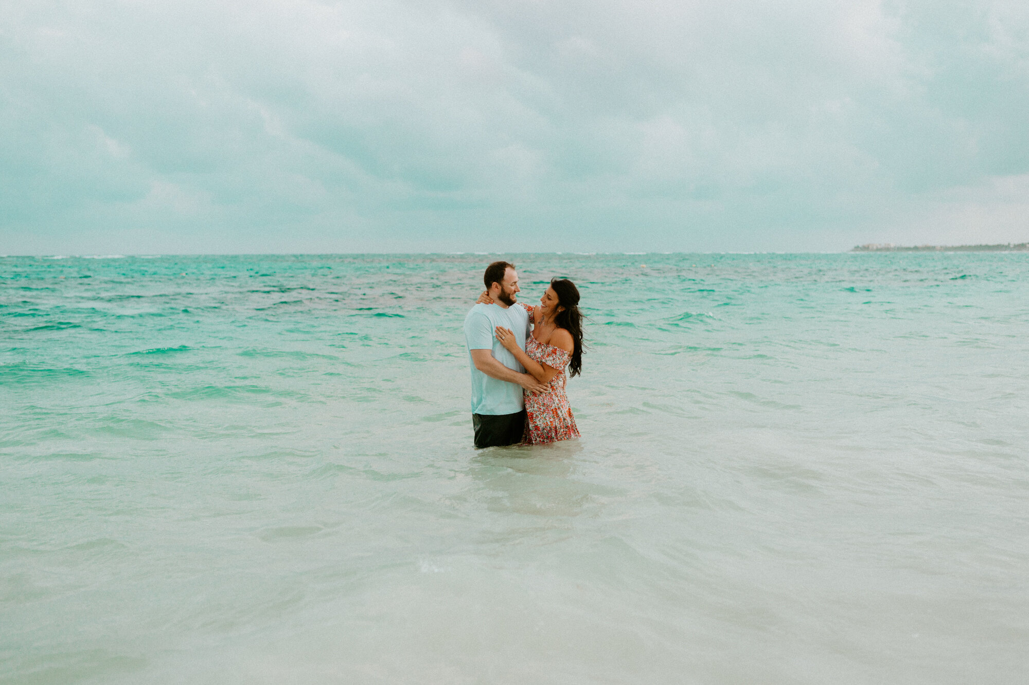 couple on the beach in riviera maya mexico