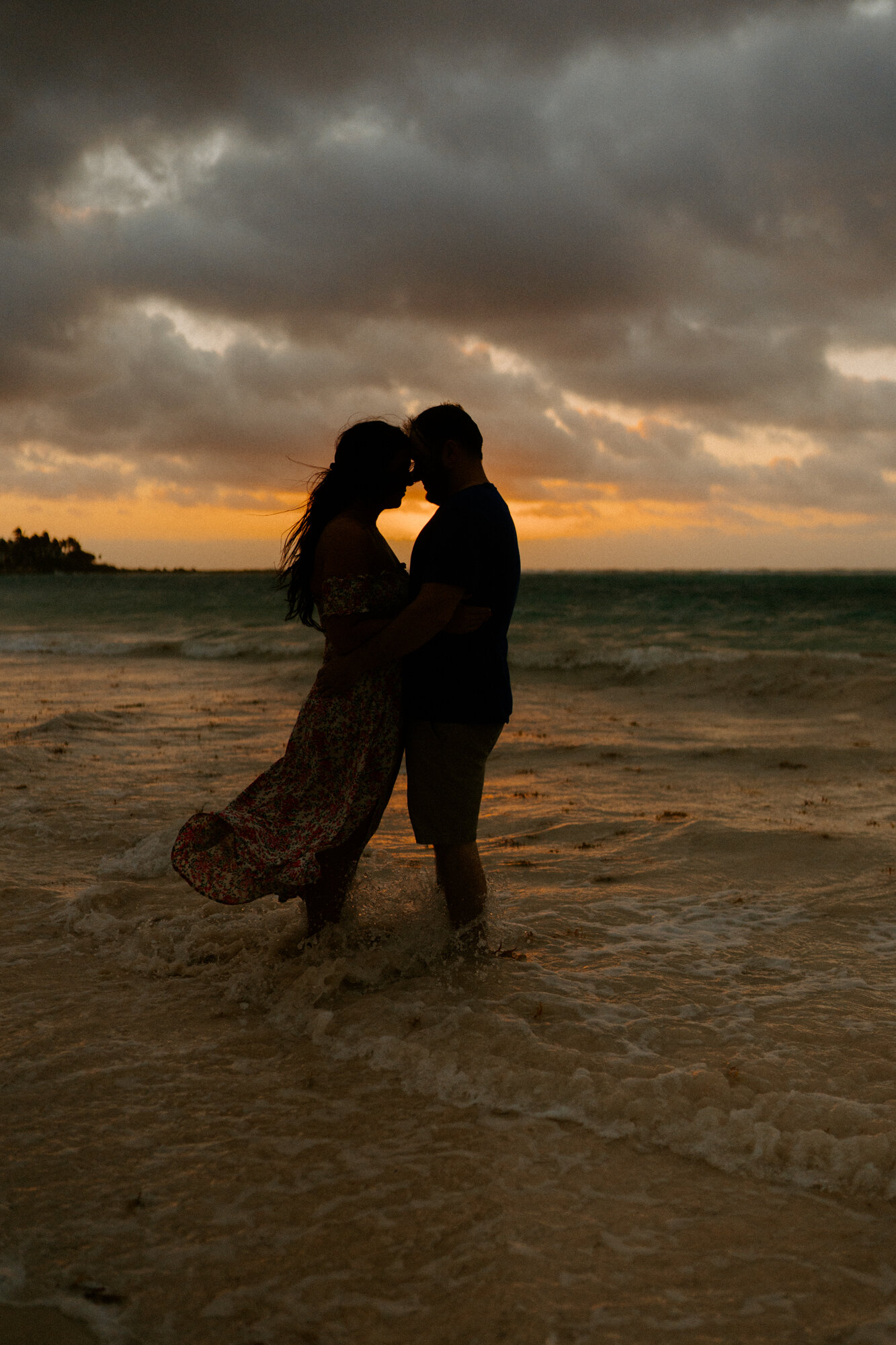 couple at sunrise on the beach riviera maya mexico