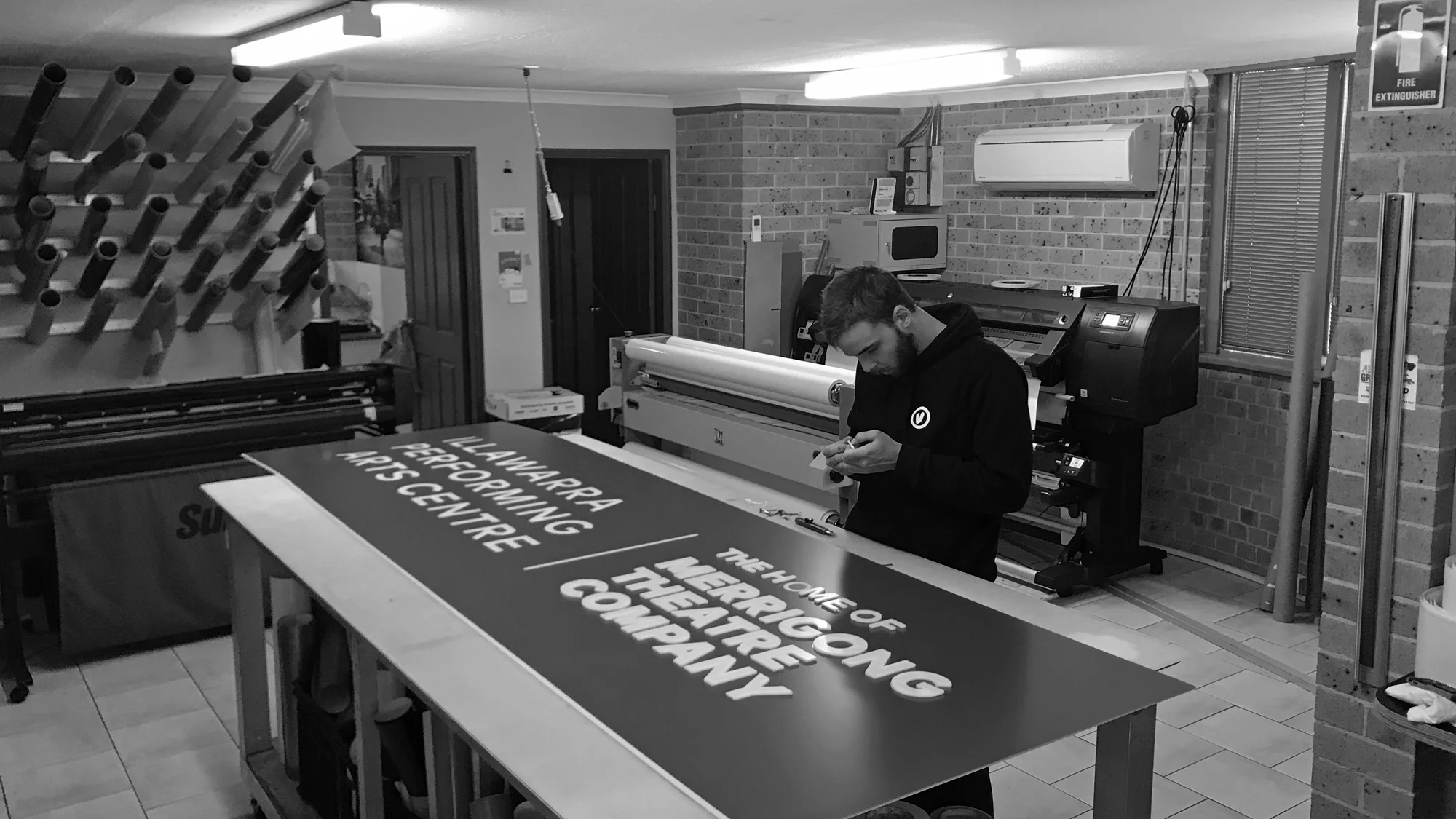 The application of profile cut letters in the graphics room.