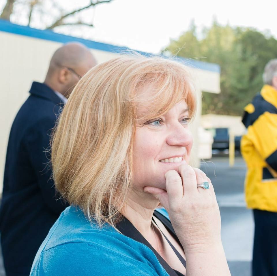 The Author watching her students win an award.