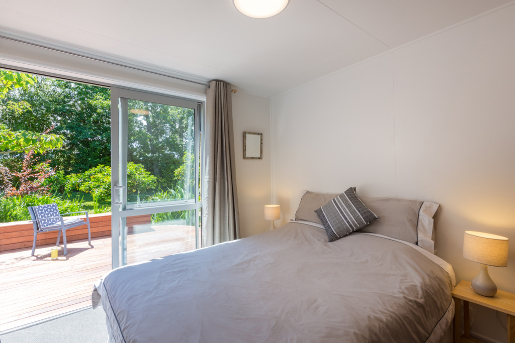 Tui-Cottage-bedroom-2-with-deck.jpg