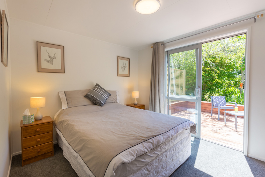 Tui-Cottage-main-bedroom-with-deck.jpg