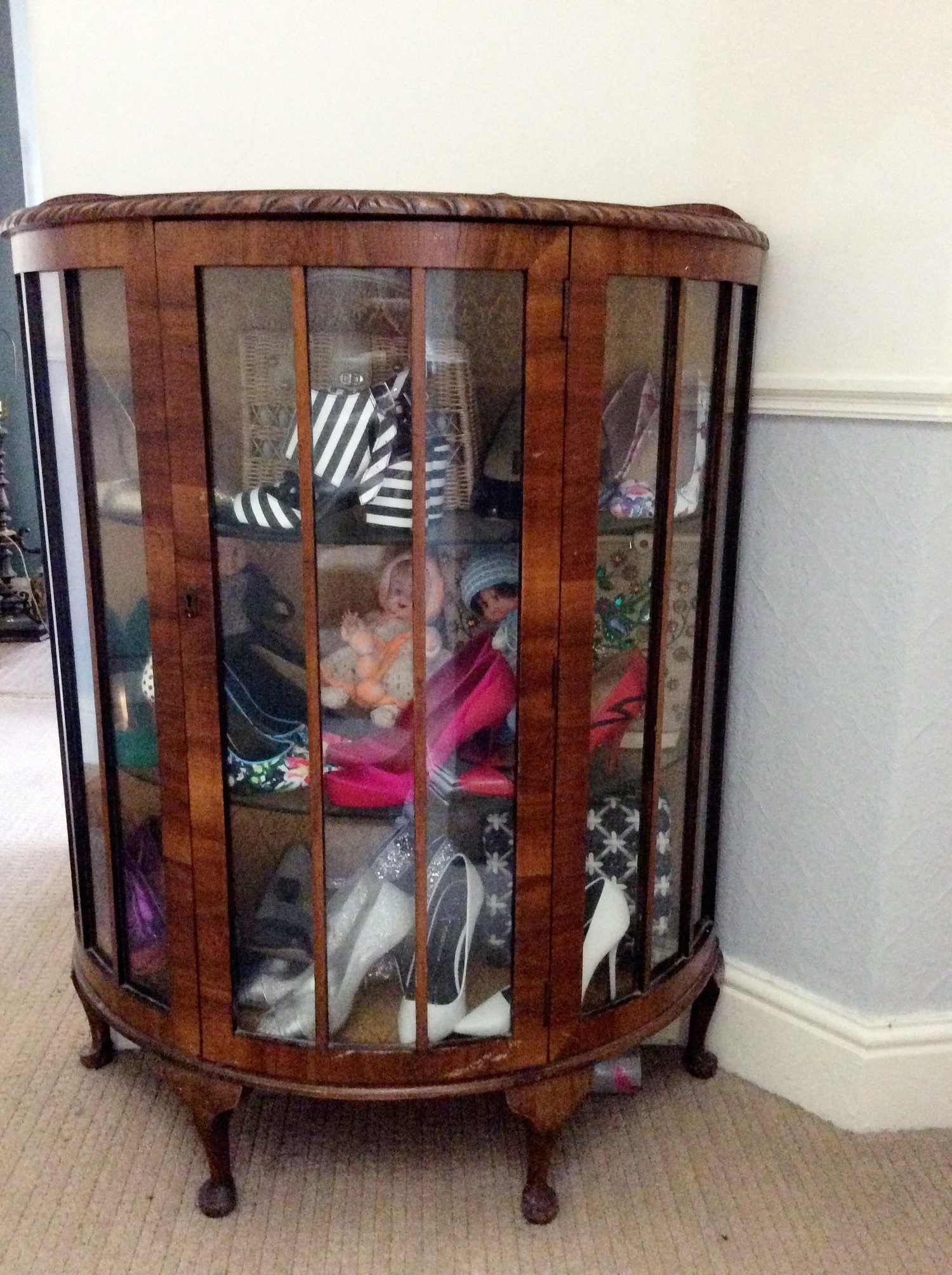 Originally a dark brown wood with an unflattering brocade lining.