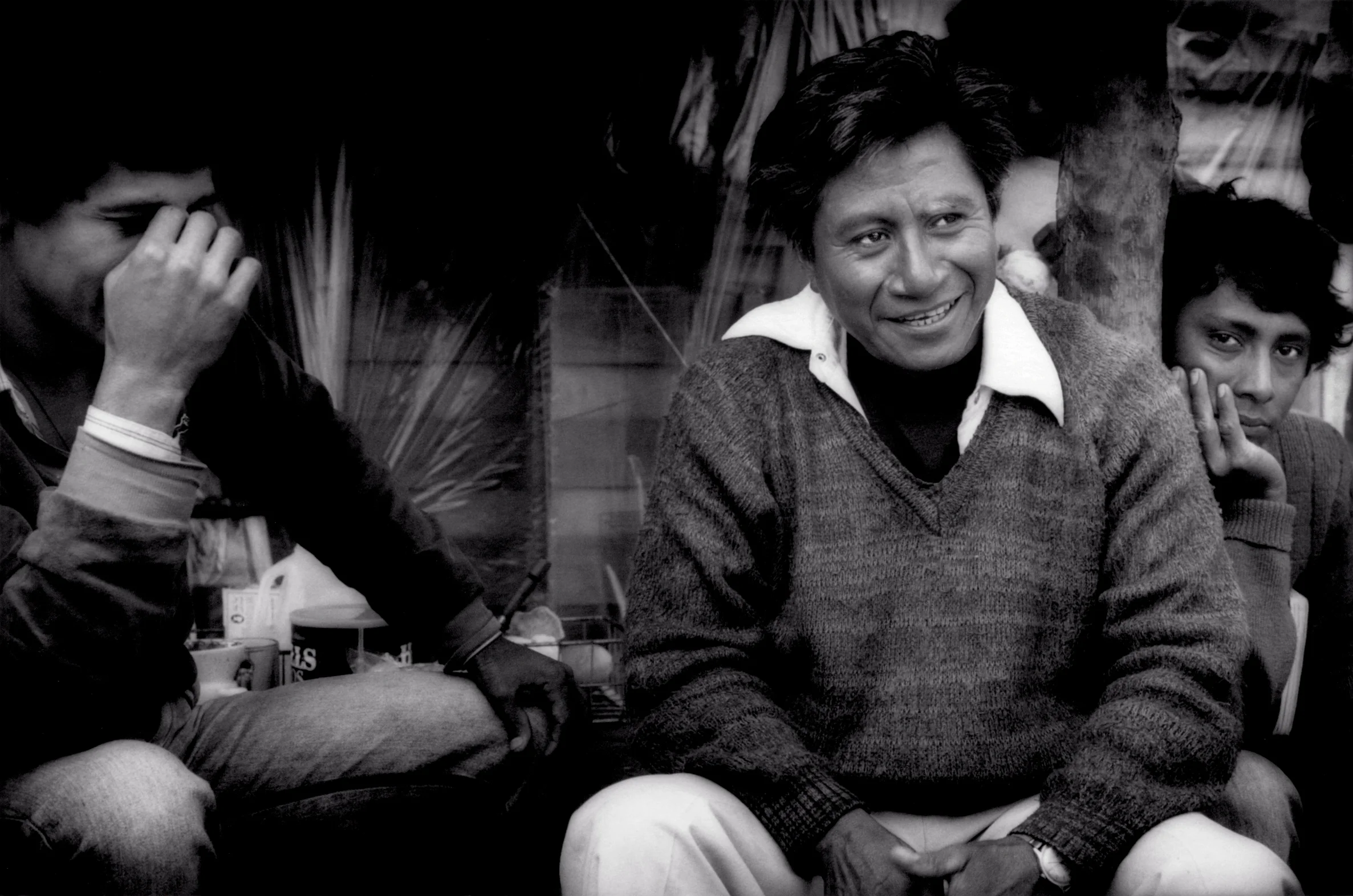 Migrant farm workers from the Mexican state of Guerrero relax in front of one of their makeshift homes, in 2006, erected in a remote canyon beside fields in northern San Diego County, California, USA. 