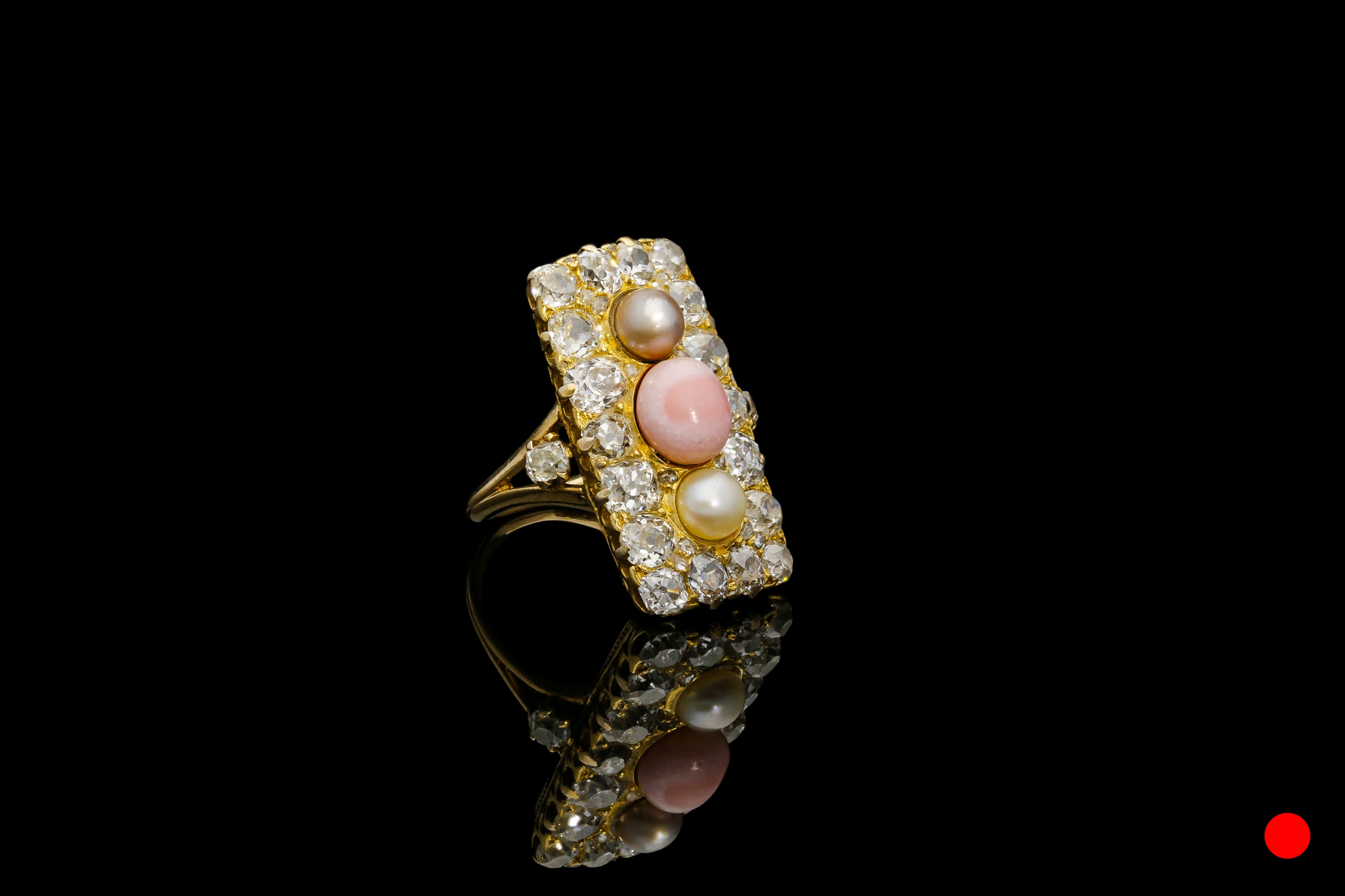 A Victorian conch pearl,cluster shield ring | £4750