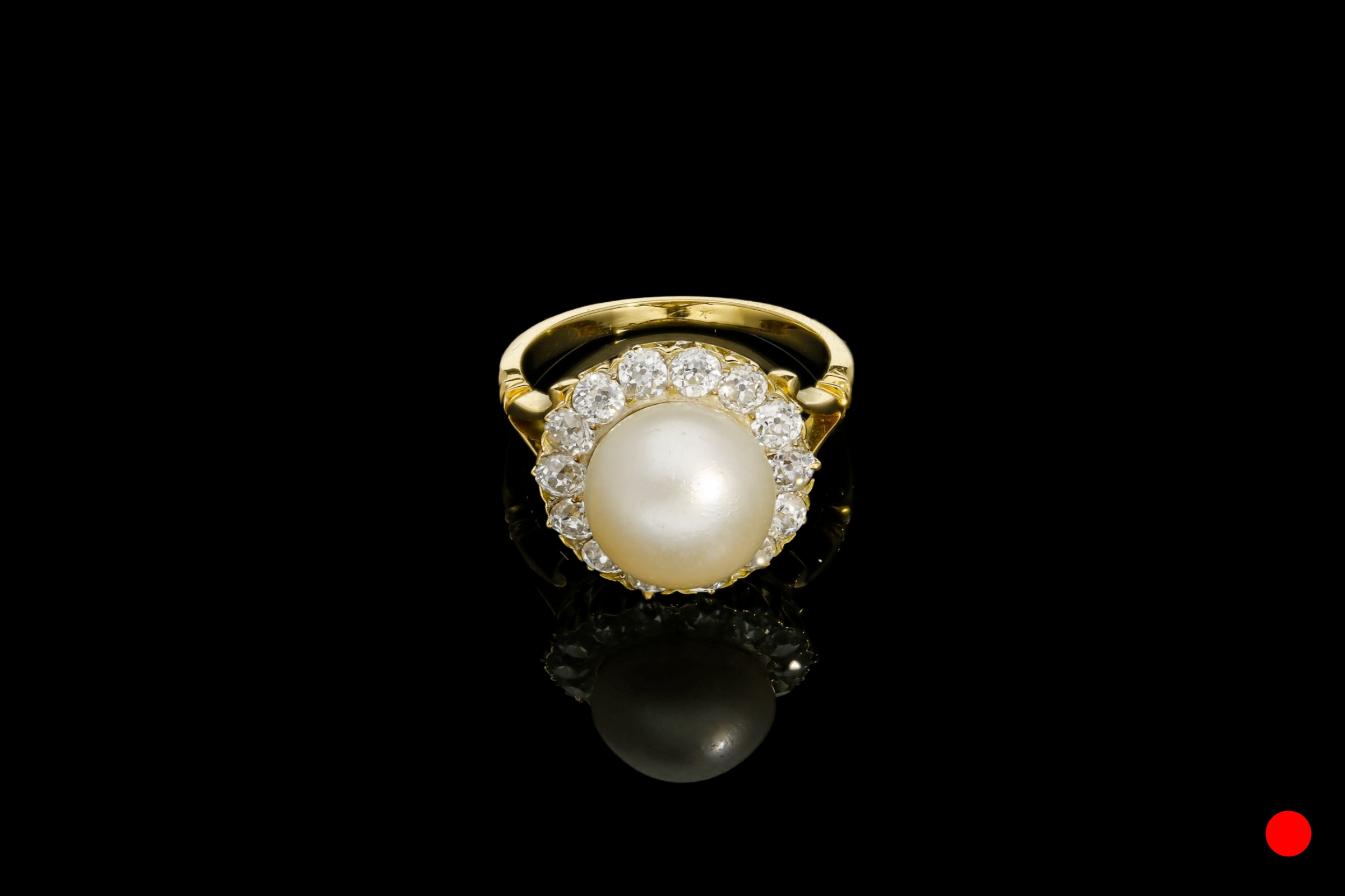 A natural buton pearl and diamond cluster ring | £6850