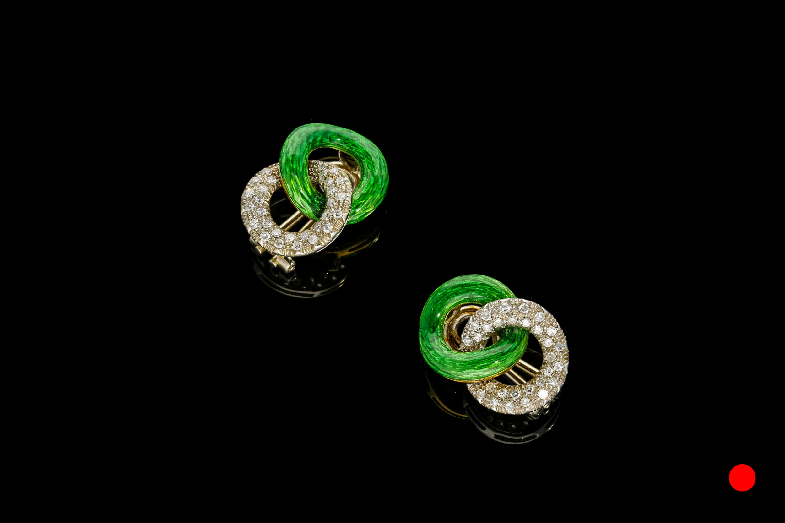 A pair of 1940's vibrant green guilloche enamel and diamond clip earrings set | £5450