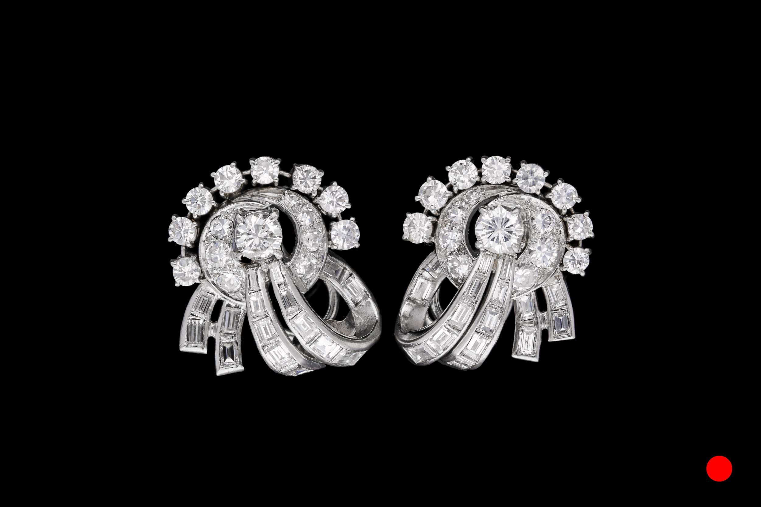 A pair of platinum 1950's diamond set clip earrings | £13500