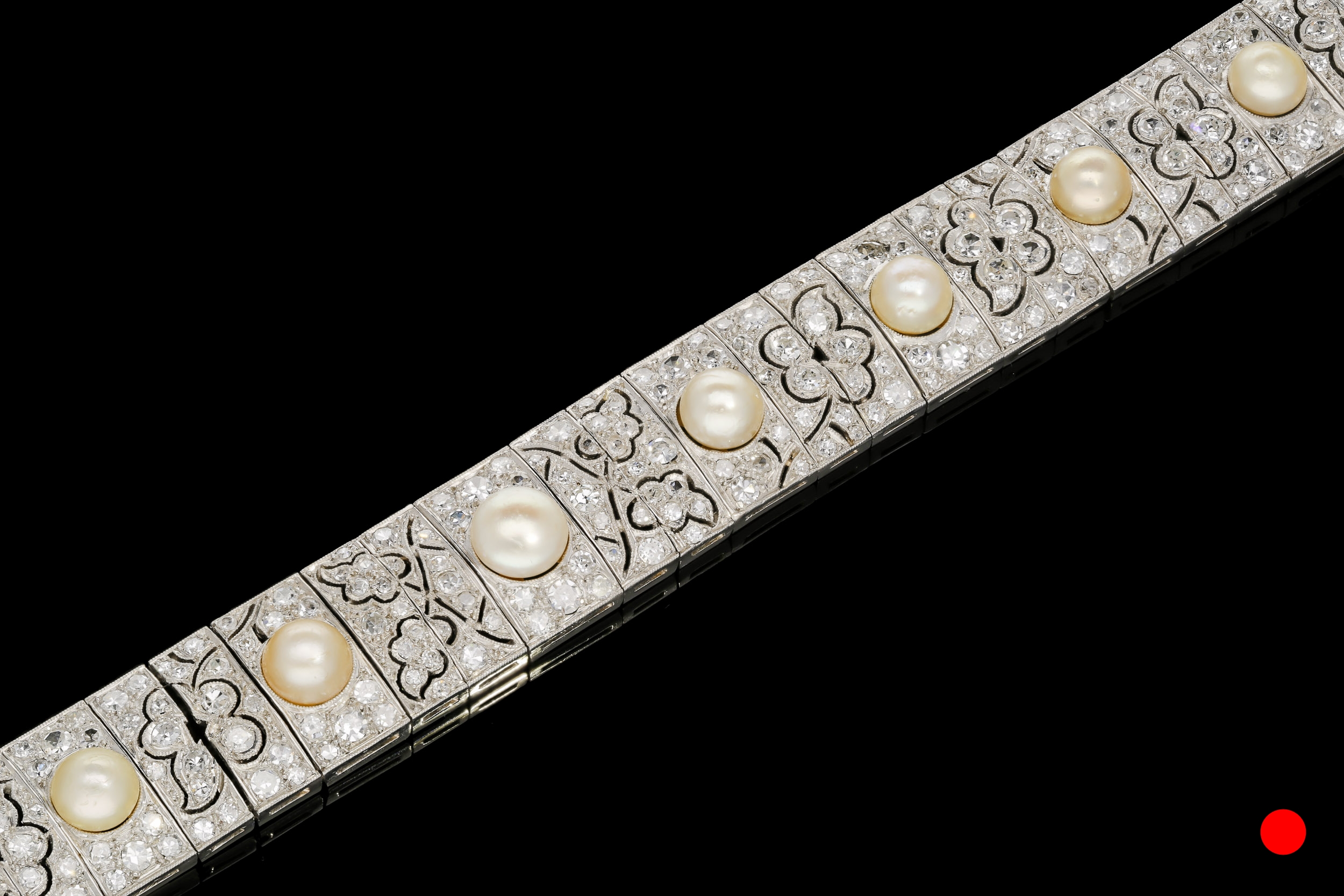 A 1920's natural floral panel bracelet set | £21500