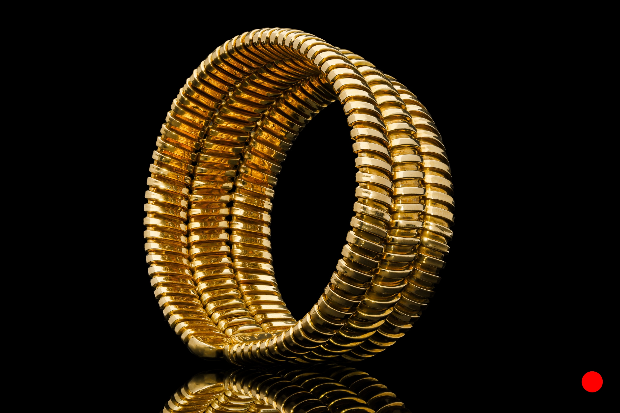 A 1960's gold three-tiered bangle | £5950