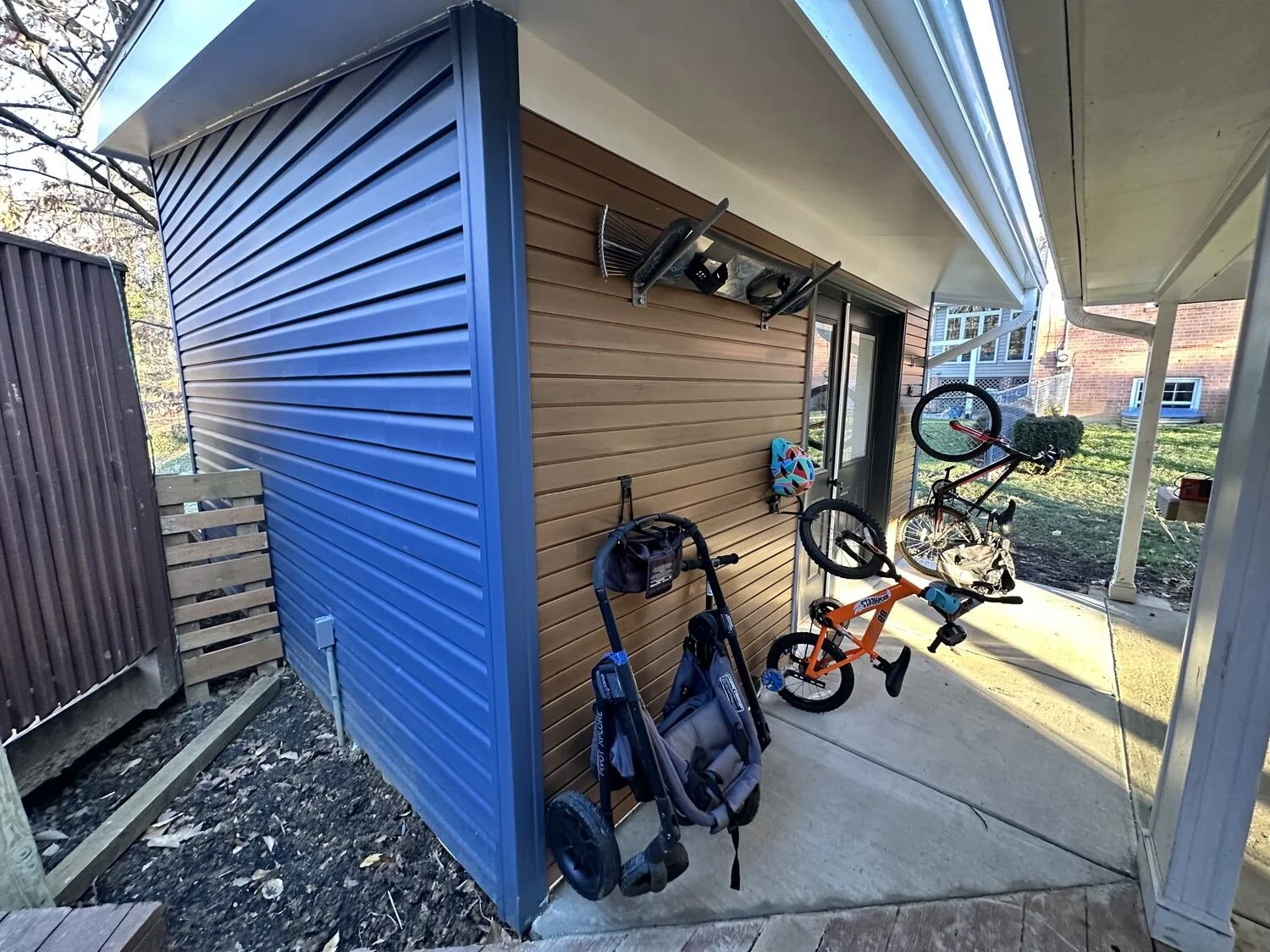 Workshop addition double door and wood paneling, Annandale