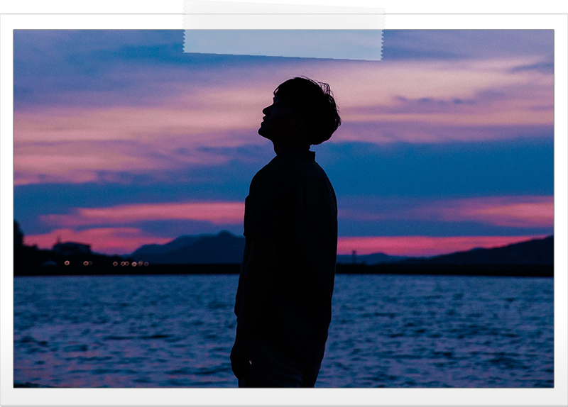man-silhouette-looking-up-sunset.png