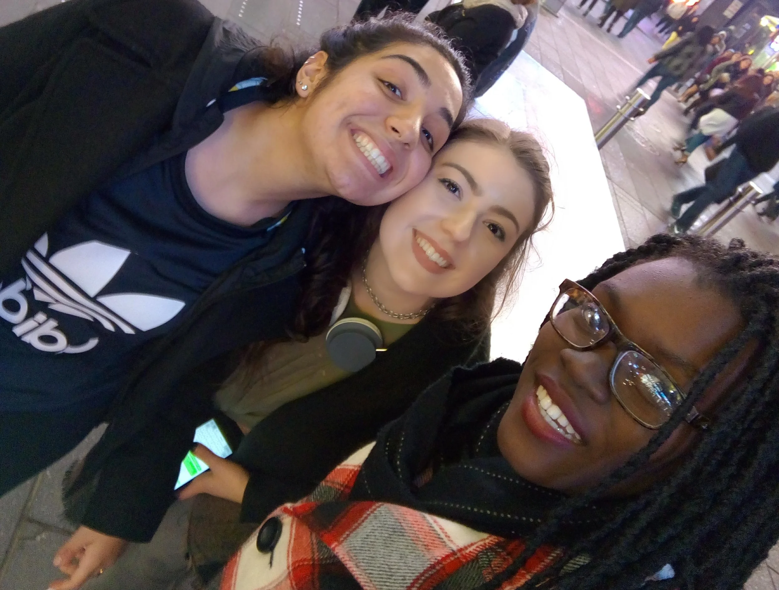 Too-rom with her King's roommates at Times Square. 