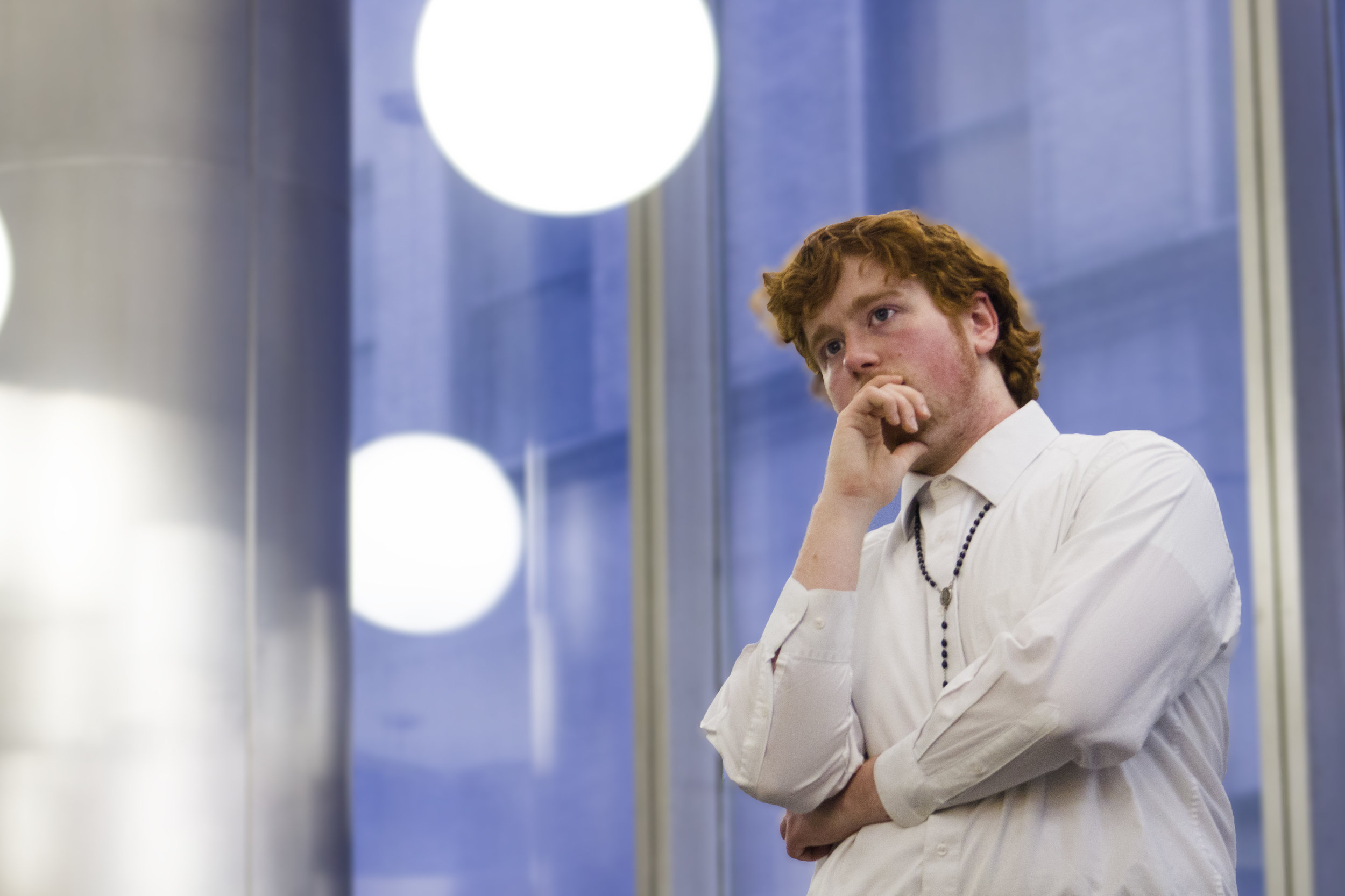 House of Lewis Chamberlain, Eddie Vanzandt poses for the camera outside The King's College Lobby. || Photo by Bernadette Berdychowski