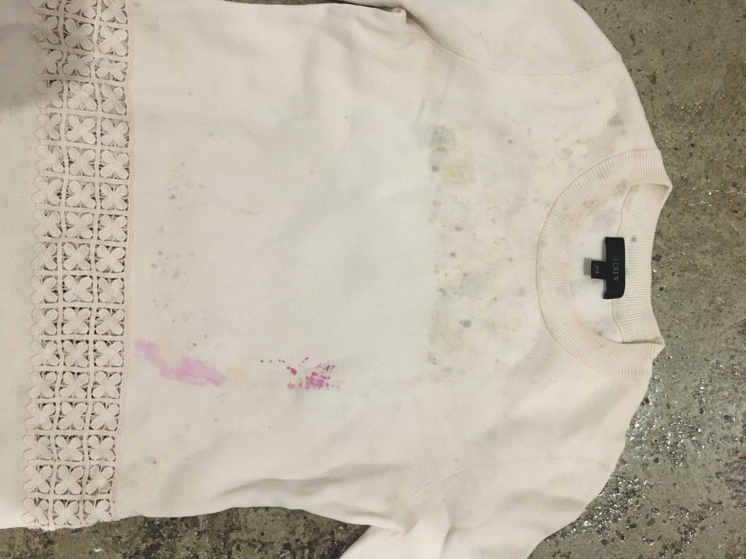 Lauren Pannell's sweater with ink stains from wet tags.